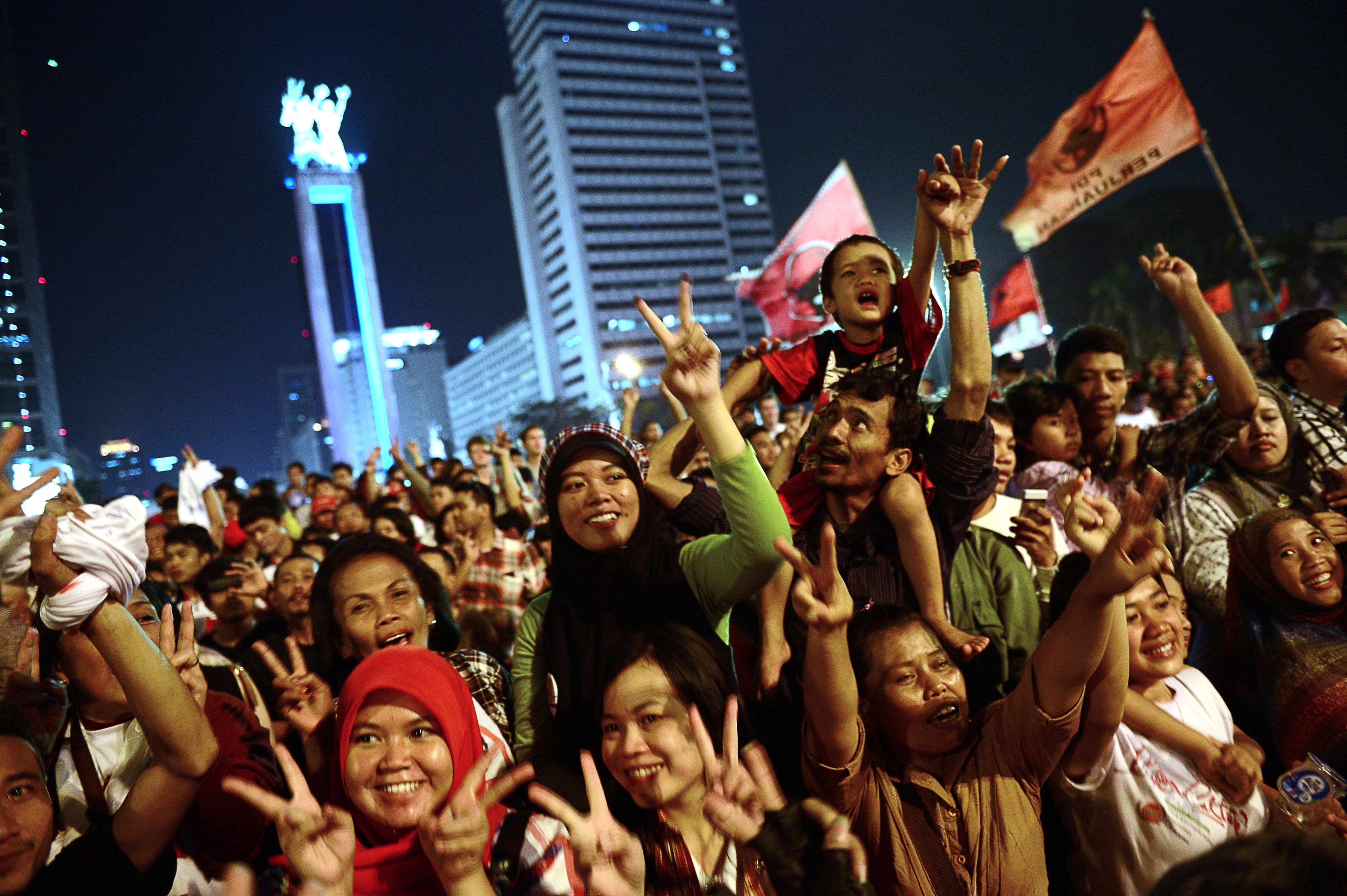 Supporters of Indonesian presidential candidate Joko Widodo rally in central Jakarta after the close of polls on July 9, 2014 (ROMEO GACAD—AFP/Getty Images)