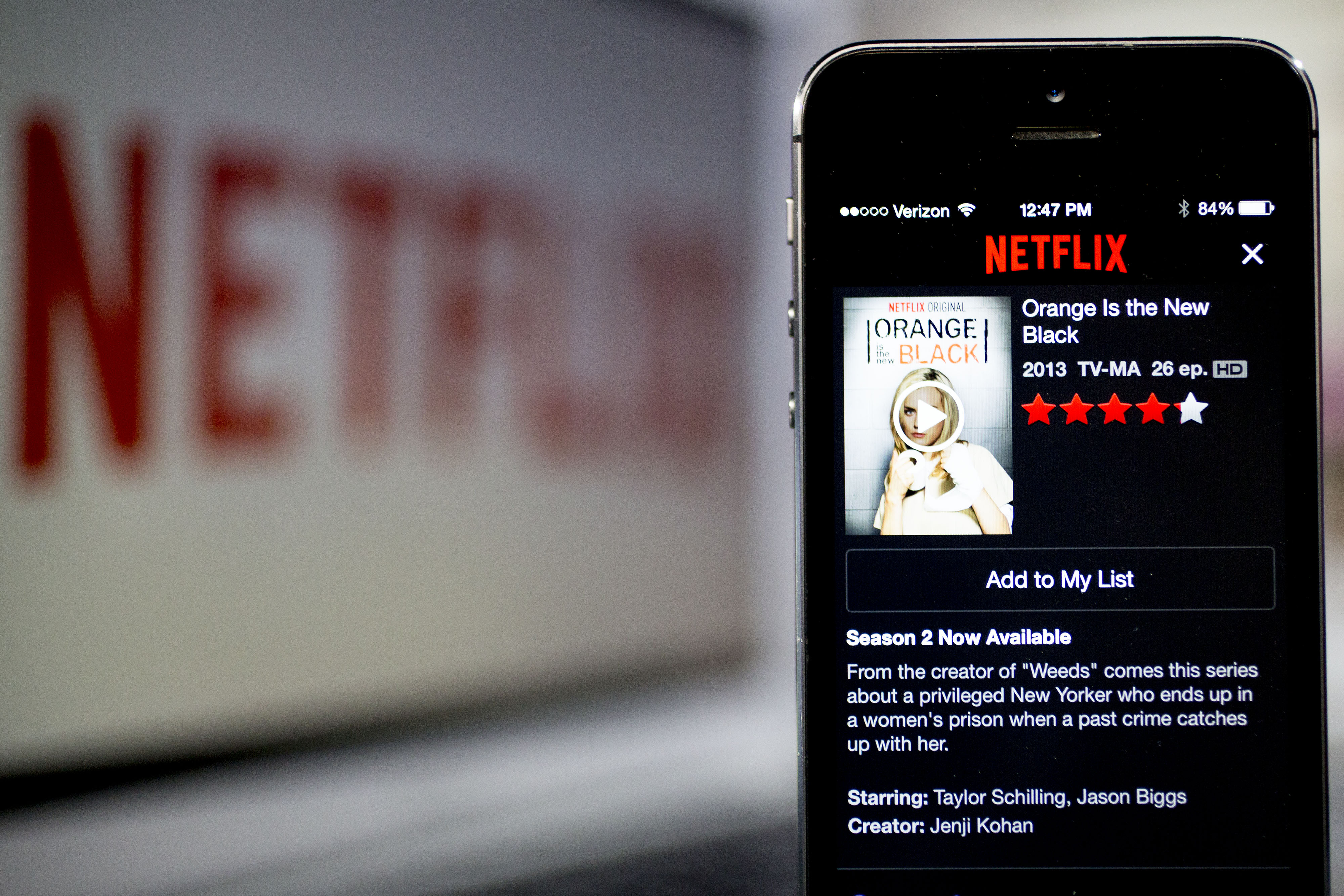 The Netflix Inc. application (app) displays the "Orange is the New Black" series on an Apple Inc. iPhone 5s in this arranged photograph in Washington, D.C., U.S., on Wednesday, July 9, 2014. (Bloomberg—Bloomberg via Getty Images)