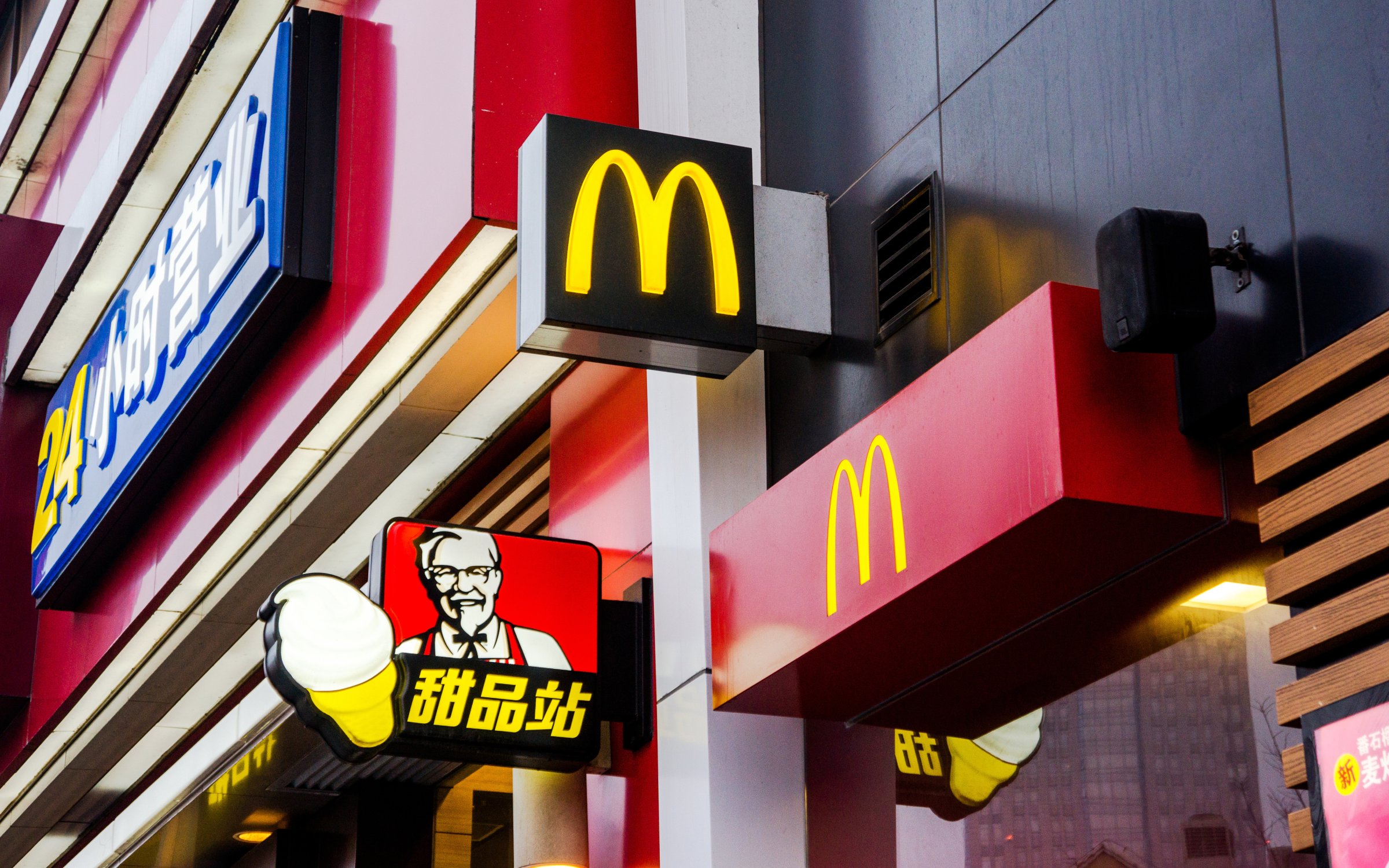 A 24 hour McDonalds restaurant in a shopping mall. KFC,