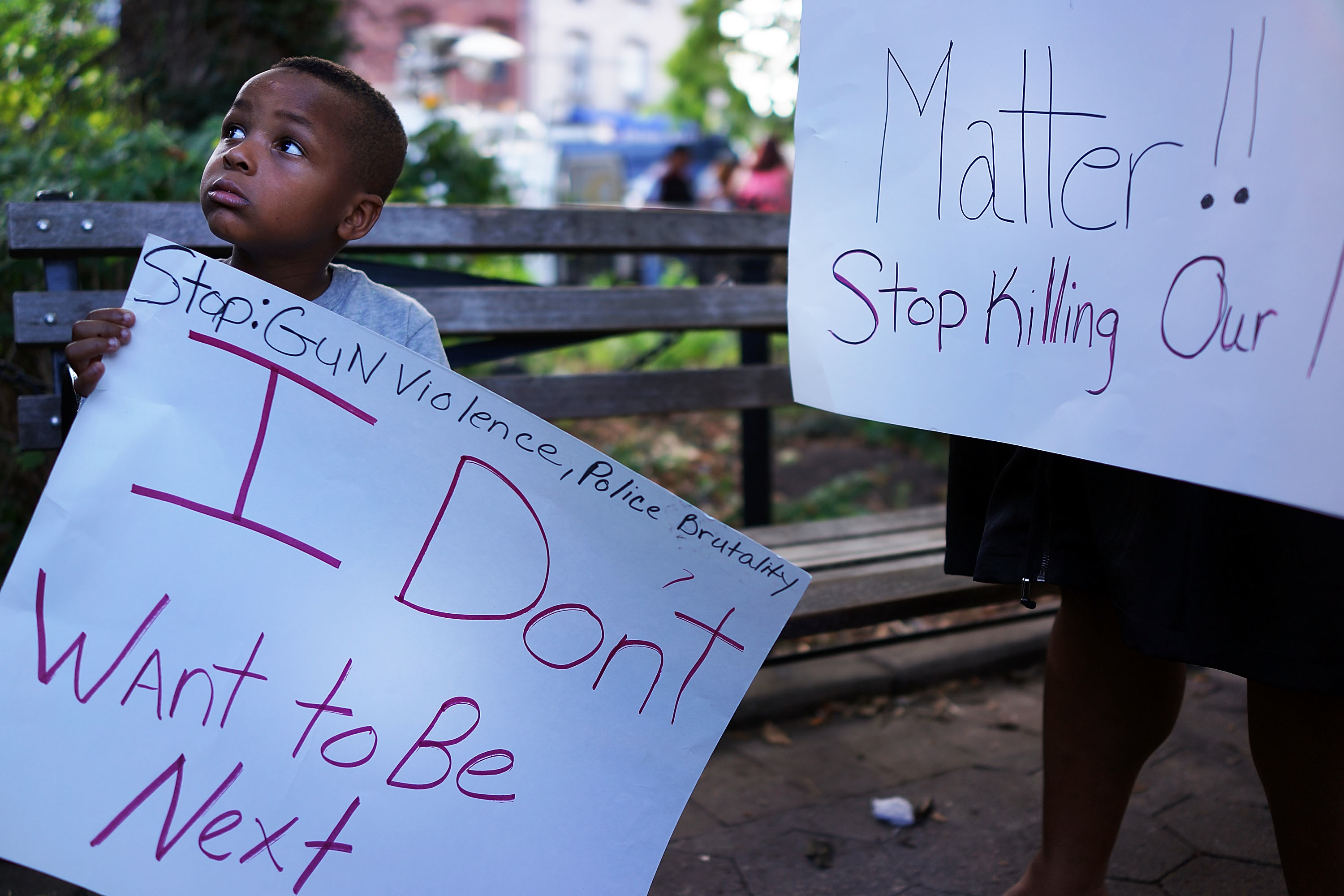 Richard Watkins (5) attends a vigil for Eric Garner near where he died after he was taken into police custody in Staten Island last Thursday on July 22, 2014 in New York City. (Spencer Platt—Getty Images)