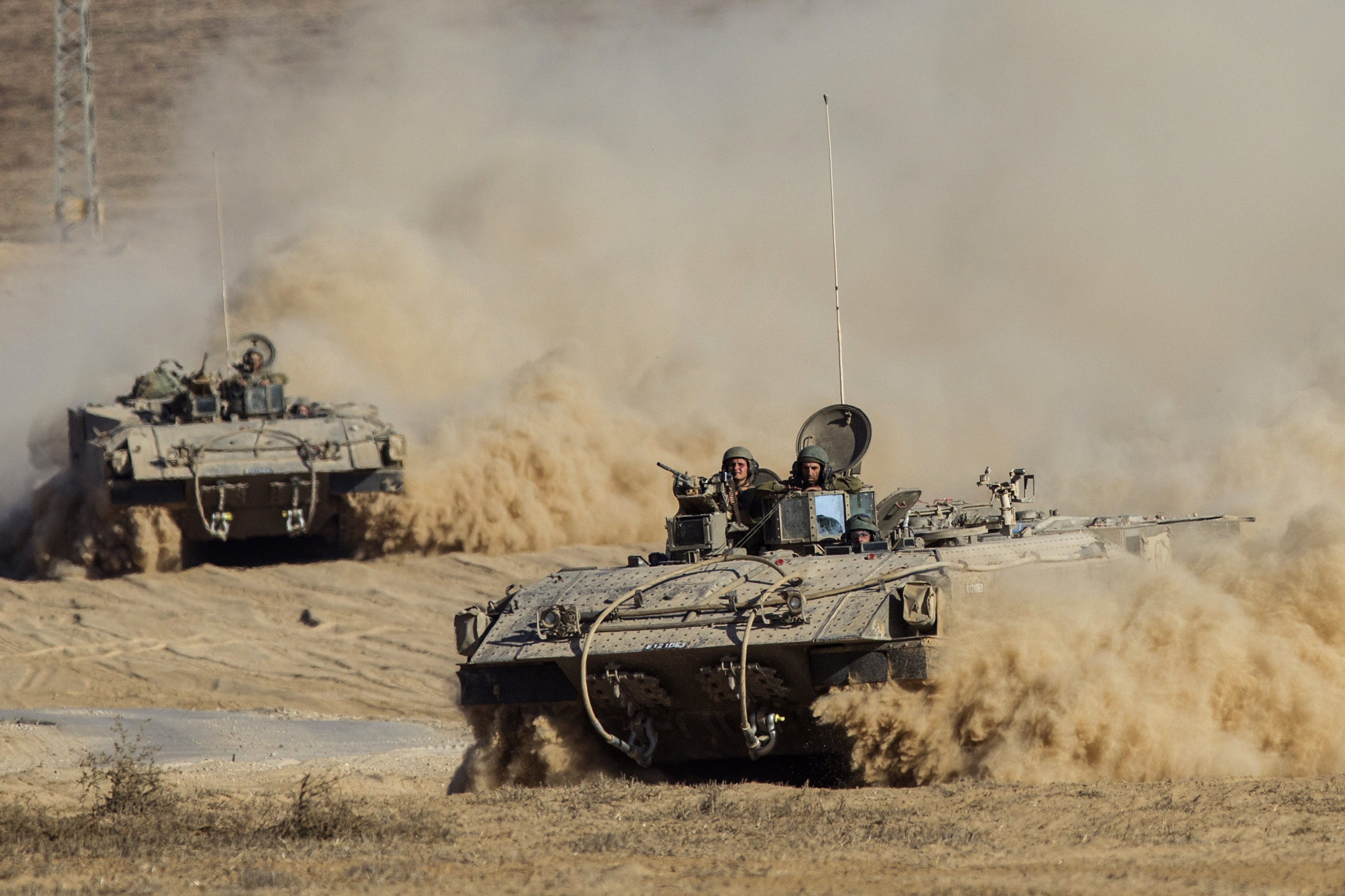 Israeli army armored personnel carriers (APC) move along Israel's border with the Gaza Strip on July 30, 2014. (JACK GUEZ—AFP/Getty Images)