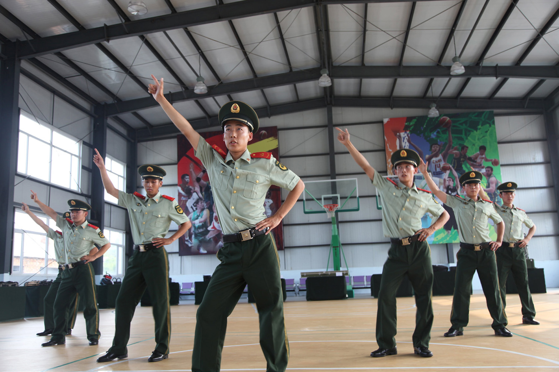 JILIN, CHINA - JULY 30: (CHINA OUT) Police officers dance along with the ''Little Apple'' song (by Chopsticks Brothers) to release pressure on July 30, 2014 in Jilin province of China. (Photo by ChinaFotoPress/ChinaFotoPress via Getty Images)