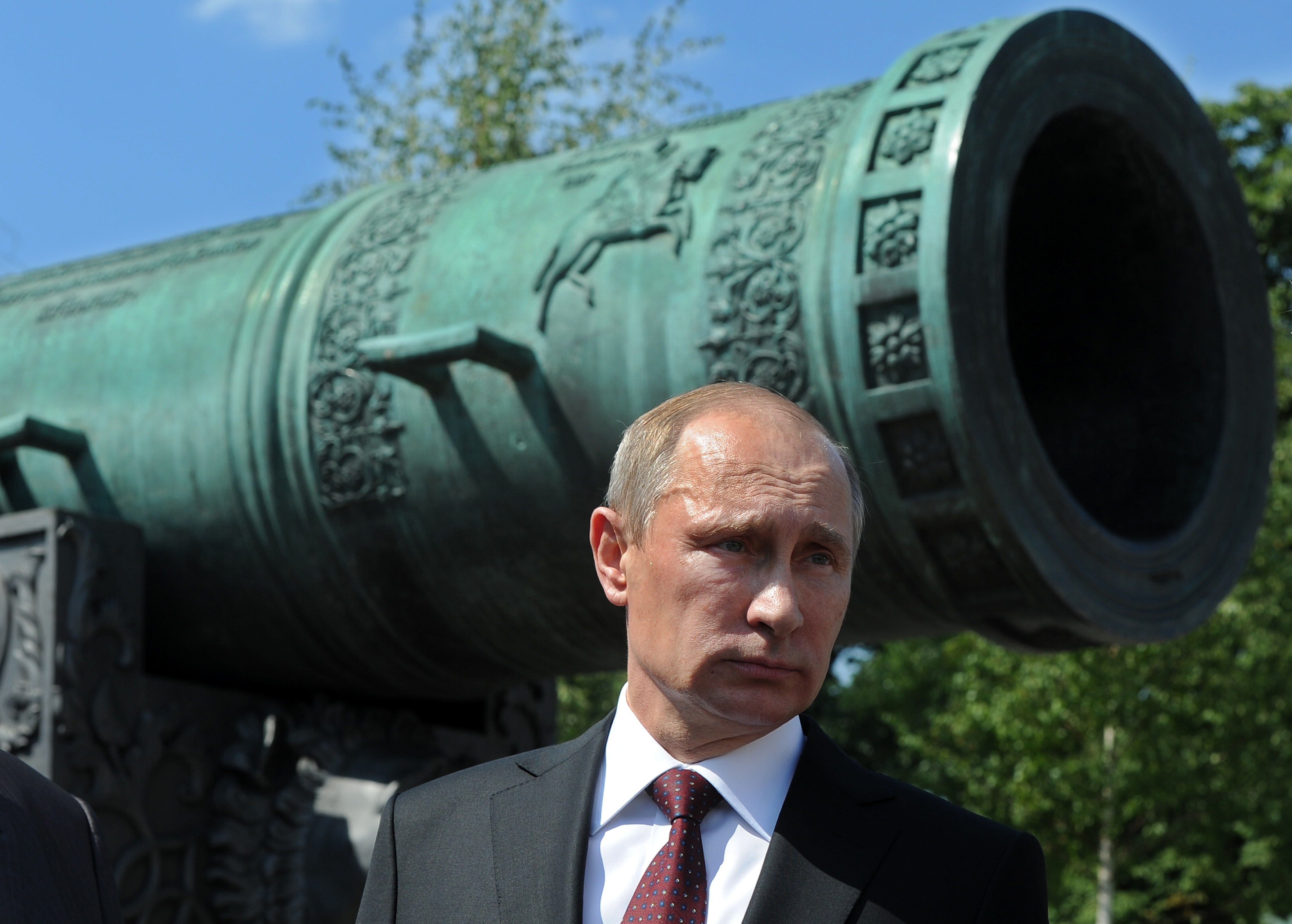 Russia's President Vladimir Putin stands in front of the 6 meters long Tsar Pushka (Tsar Cannon), one of the Russian landmarks displayed in the Kremlin in Moscow, on July 31, 2014. (MIKHAIL KLIMENTYEV&mdash;AFP/Getty Images)