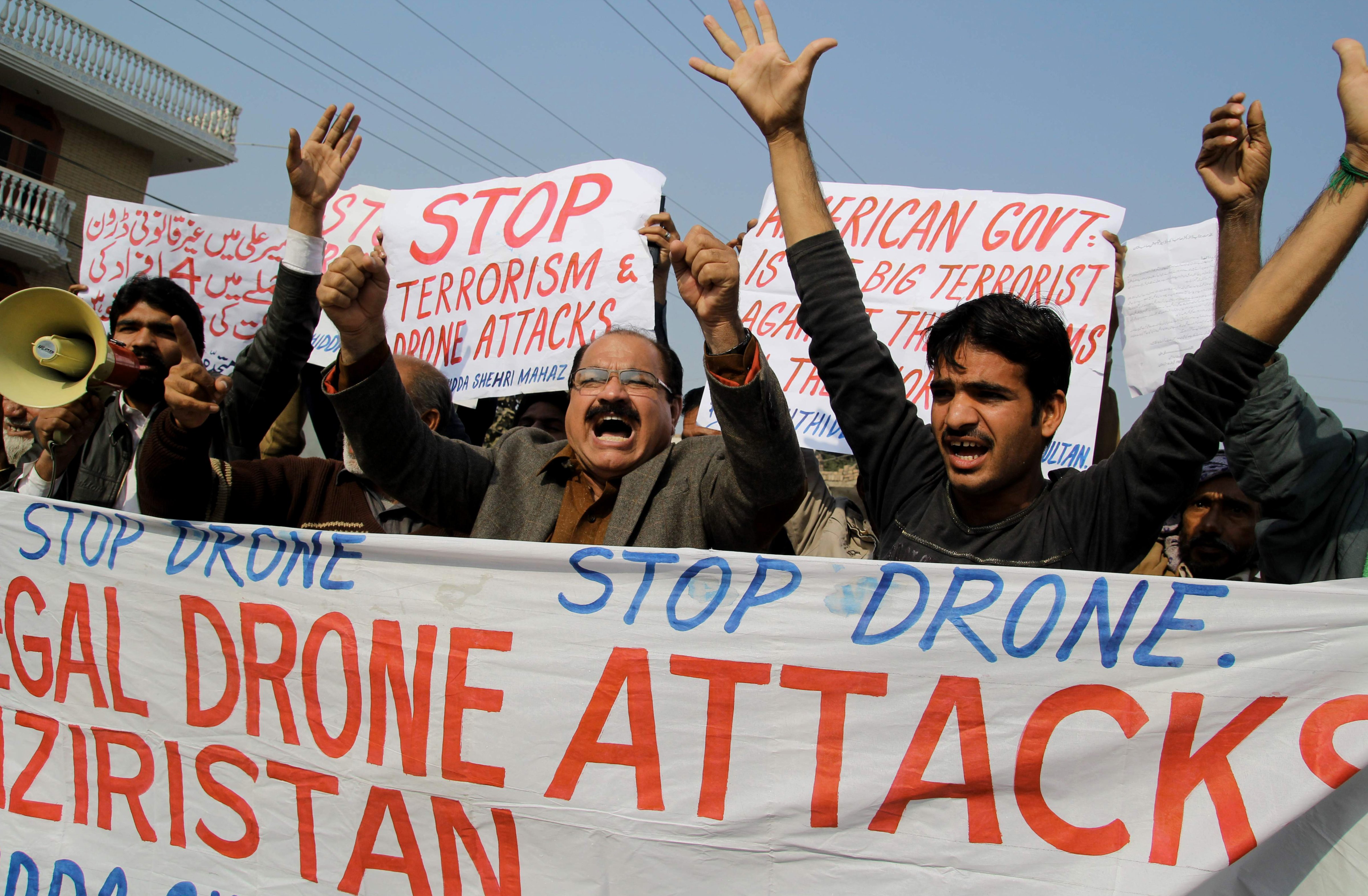 Activists shout slogans as they protest against a US drone attack in Multan, Pakistan on December 26, 2103. (S S MIRZA—AFP/Getty Images)