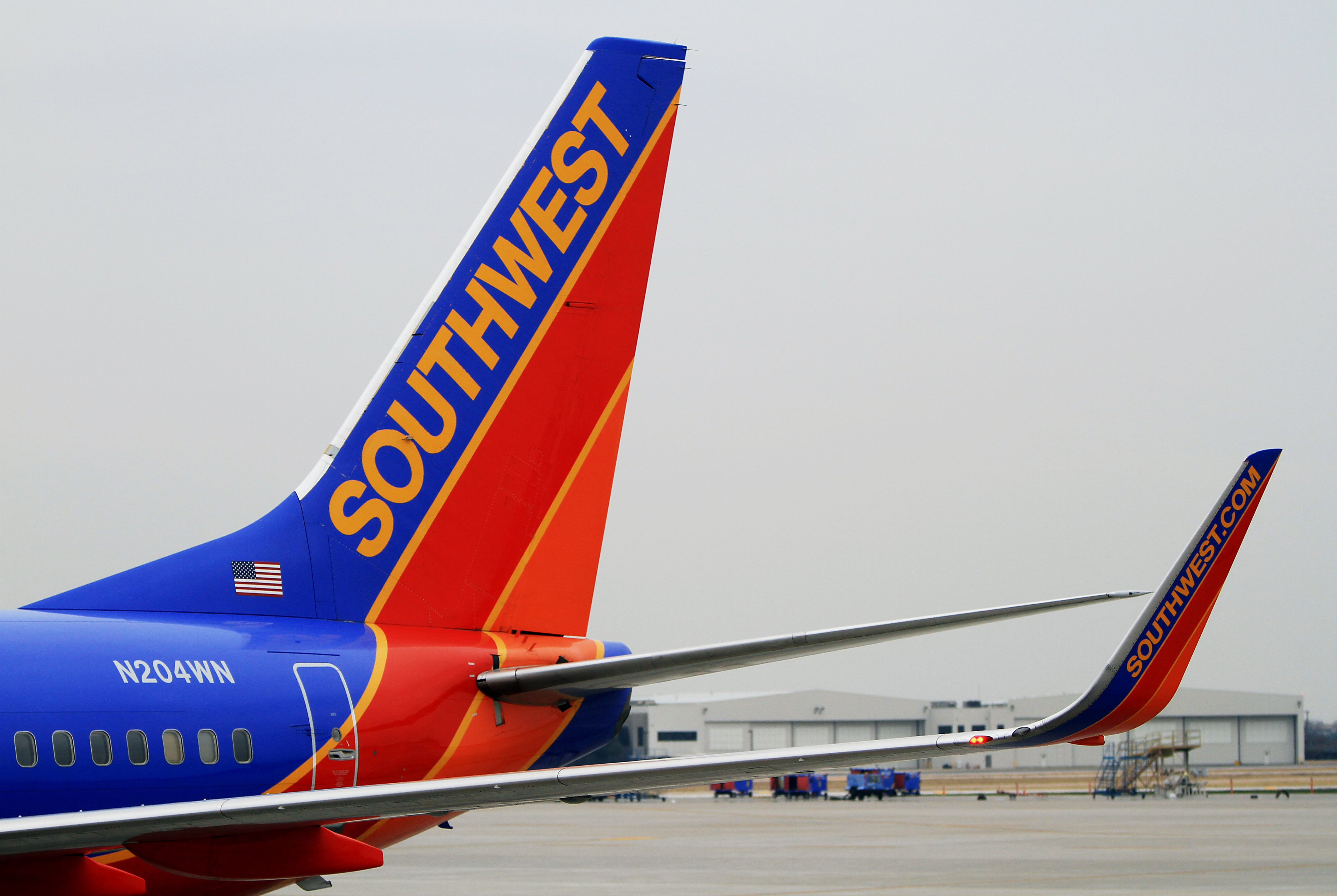 A Southwest Airlines plane sits at a gate at Dallas Love Field Airport on Feb. 3, 2014 (Ben Torres—Bloomberg via Getty Images)