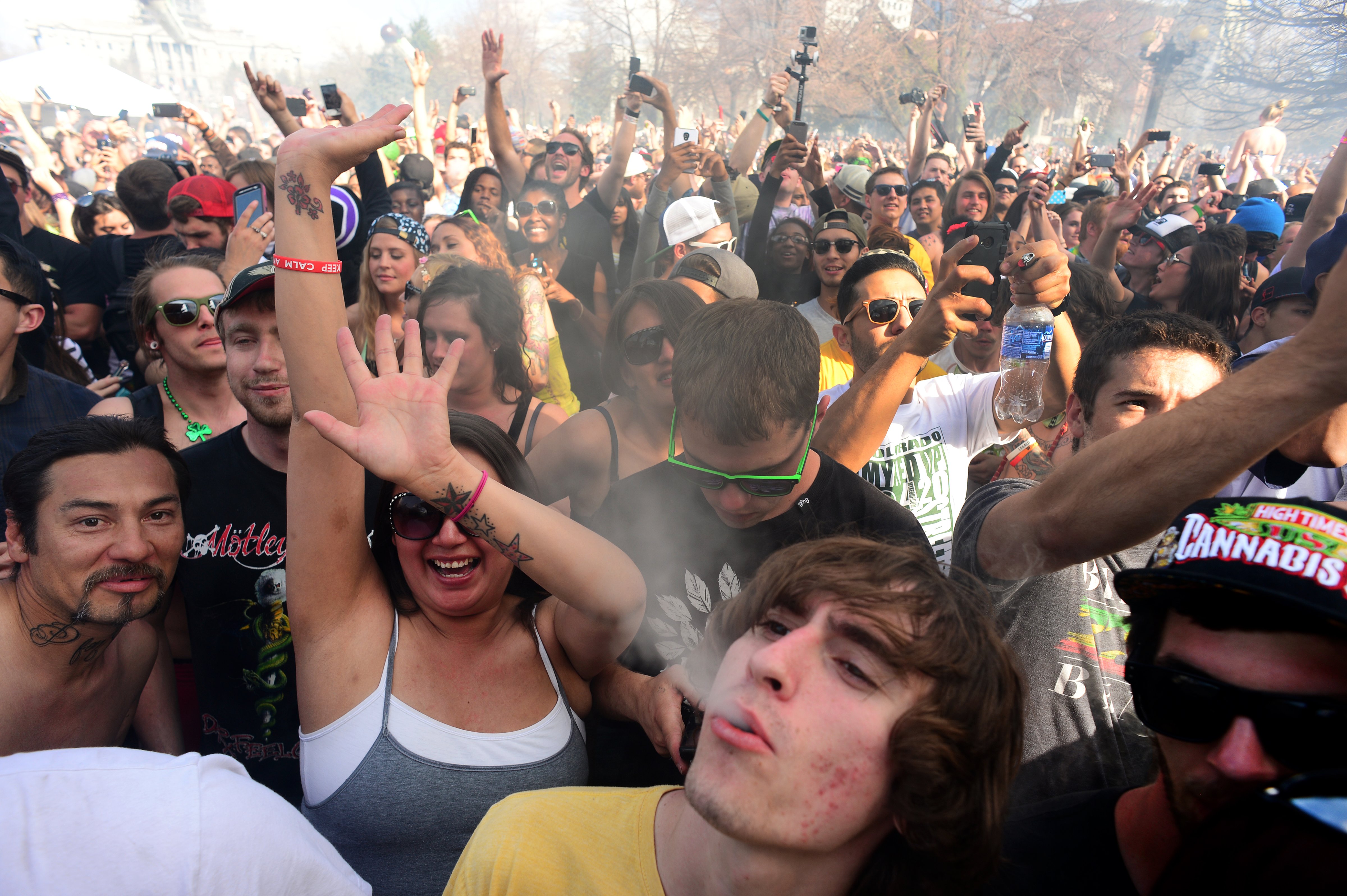 Hundreds of people lit up joints, bongs, pipes and marijuana cigarettes at exactly 4:20 p.m. during the Colorado 420 Rally at Civic Center Park in Denver on April 20, 2014, to celebrate the legal use of marijuana in the state. (Helen H. Richardson—Denver Post via Getty Images)