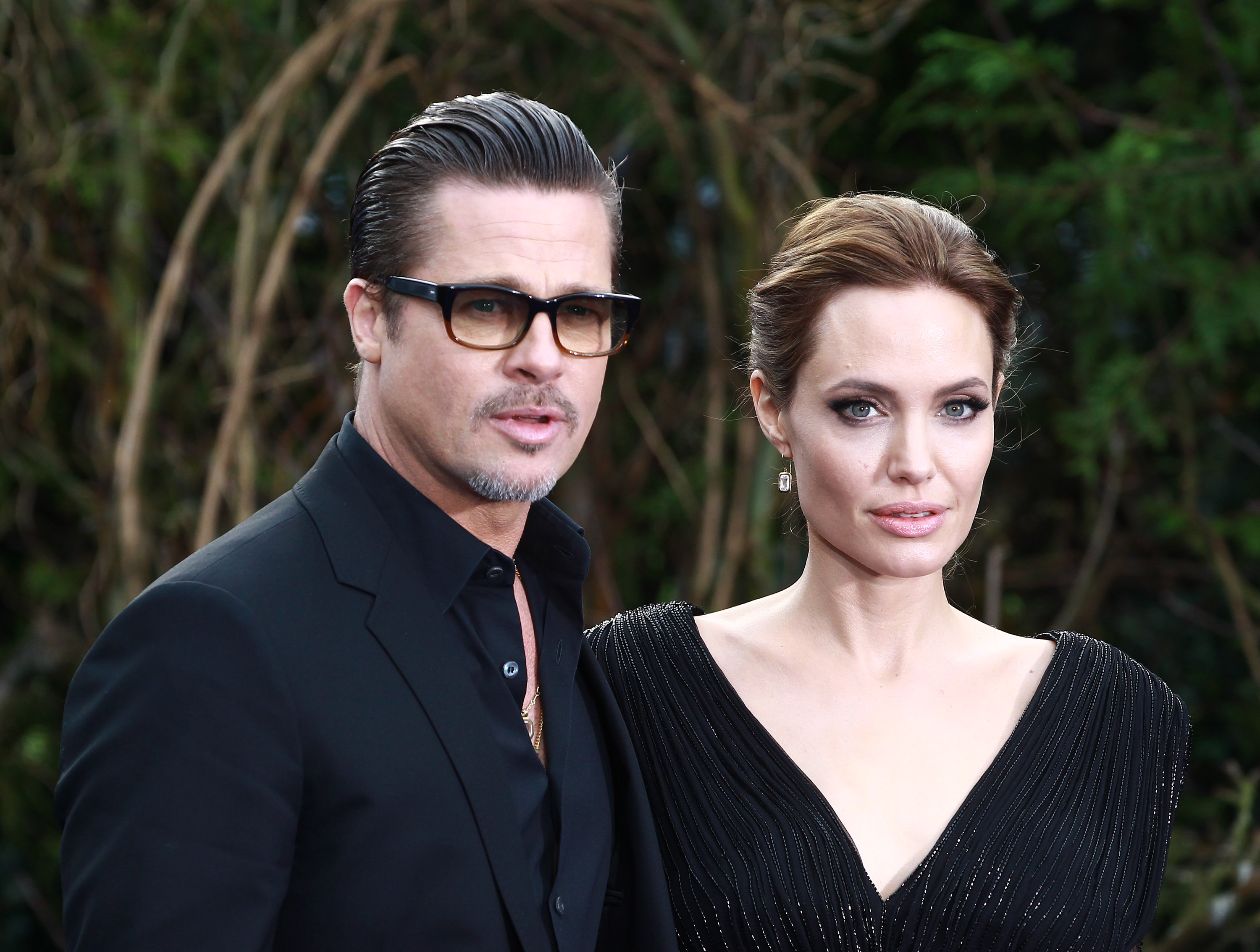 Brad Pitt and Angelina Jolie attends a private reception as costumes and props from Disney's "Maleficent" are exhibited in support of Great Ormond Street Hospital at Kensington Palace on May 8, 2014 in London. (Fred Duval—FilmMagic)
