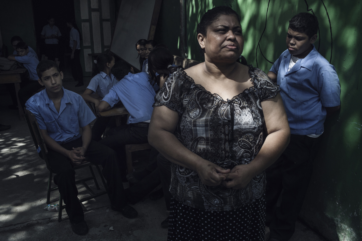 Martha Iris Triminio, 44, from Chamelecón, one of the toughest and most violent barrios in Latin America, sought to travel to the U.S. with her 14-year-old son, Roberto Carlos (left). In May, after she heard President Barack Obama was offering visas to Honduran minors, she set off on the migrant trail using a 'coyote' for help, paying more than $6,000 per person. She was deported from Mexico before she could finish the trip. Honduras. July 16, 2014.