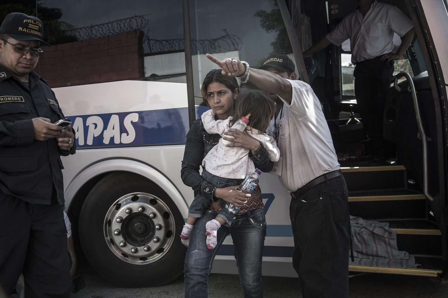 Bus loads of young mothers, children and unaccompanied minors arrive to a return center for deported migrants run by the Honduran Institute of Children and Family (INFHA), most having been deported from Mexico on their journey to the U.S.-Mexico border. San Pedro Sula, Honduras. July 17, 2014.
