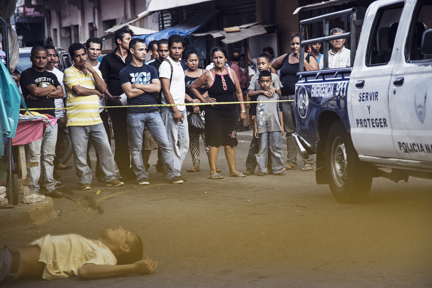 Julio Manzanares, a fruit seller at the market in the Barrio Centro neighborhood of San Pedro Sula, was gunned down on a busy Saturday afternoon. Honduras. July 19, 2014.