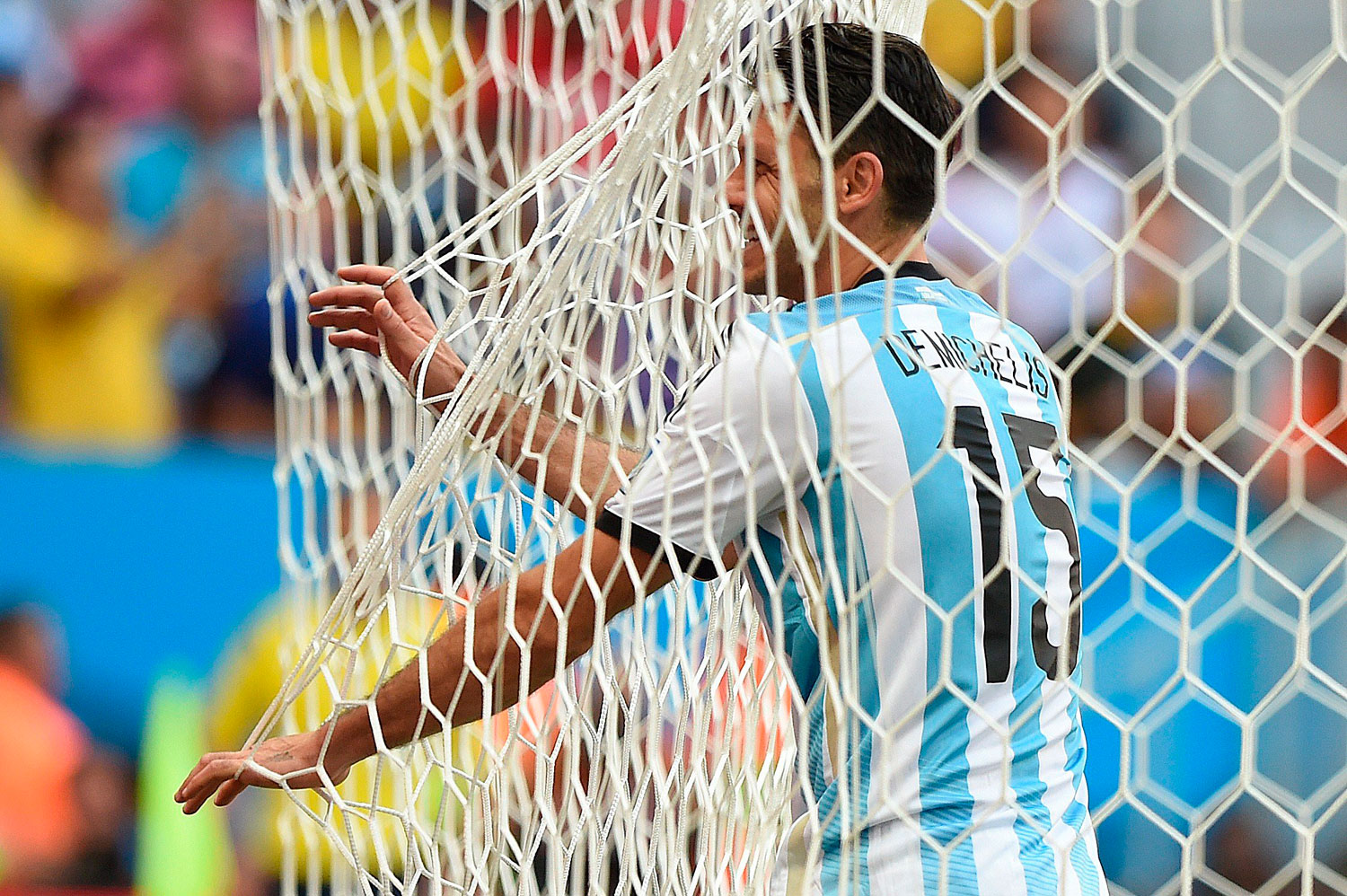 Argentina's defender Martin Demichelis stands in the nets during a quarter-final football match between Argentina and Belgium at the Mane Garrincha National Stadium in Brasilia, Brazil on July 5, 2014.