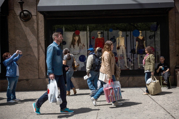 Shoppers walk through Herald Square, outside a New York City Macy's in May. (Andrew Burton&mdash;Getty Images)