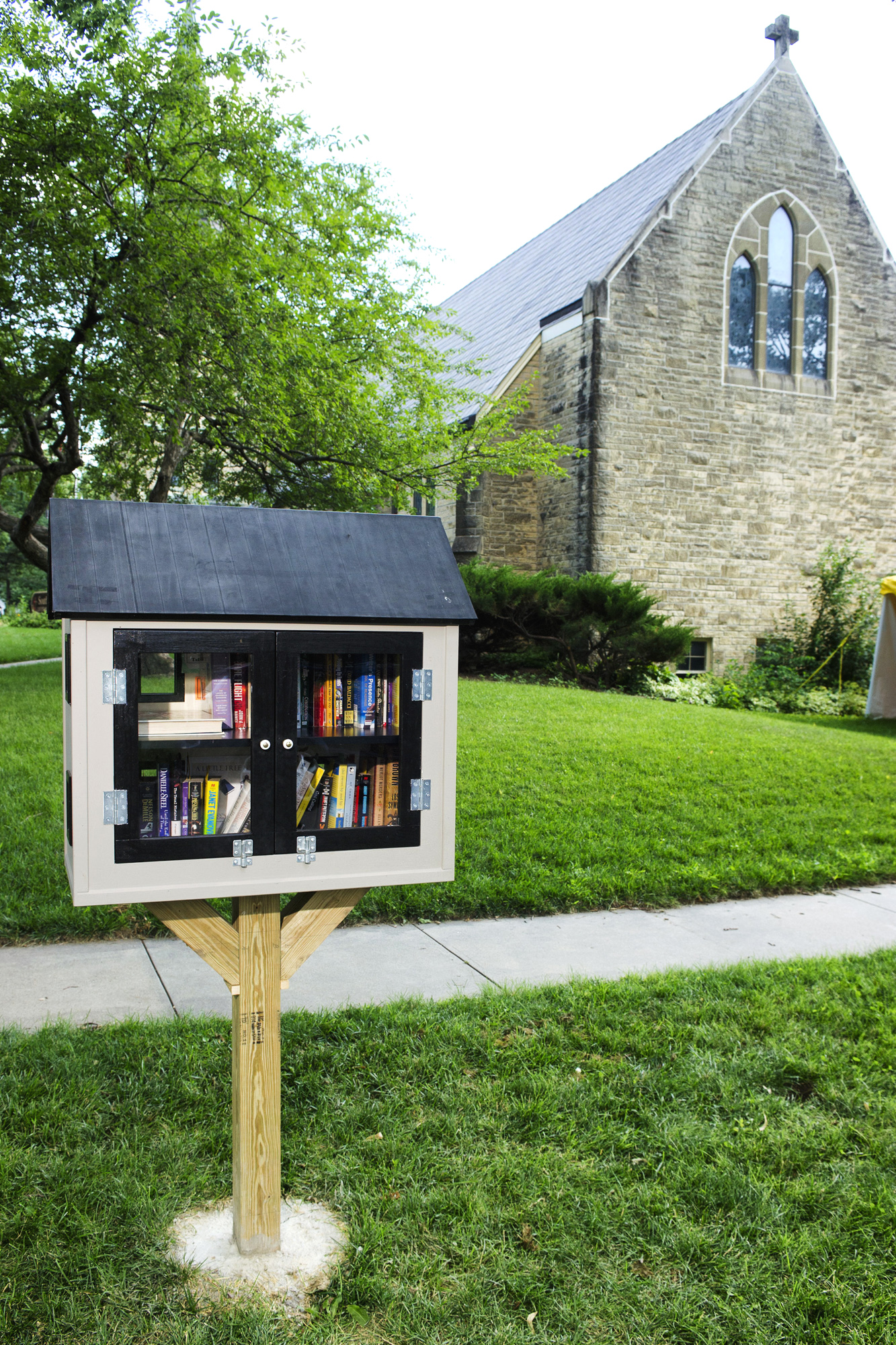 A newly built Little Free Library stands on an area between the sidewalk and the street near Southminster United Methodist Church in the Indian Village neighborhood of Lincoln, Neb., July 8. The city of Lincoln says it can't sit in a public right of way. (Matt Ryerson—Journal-Star/AP)