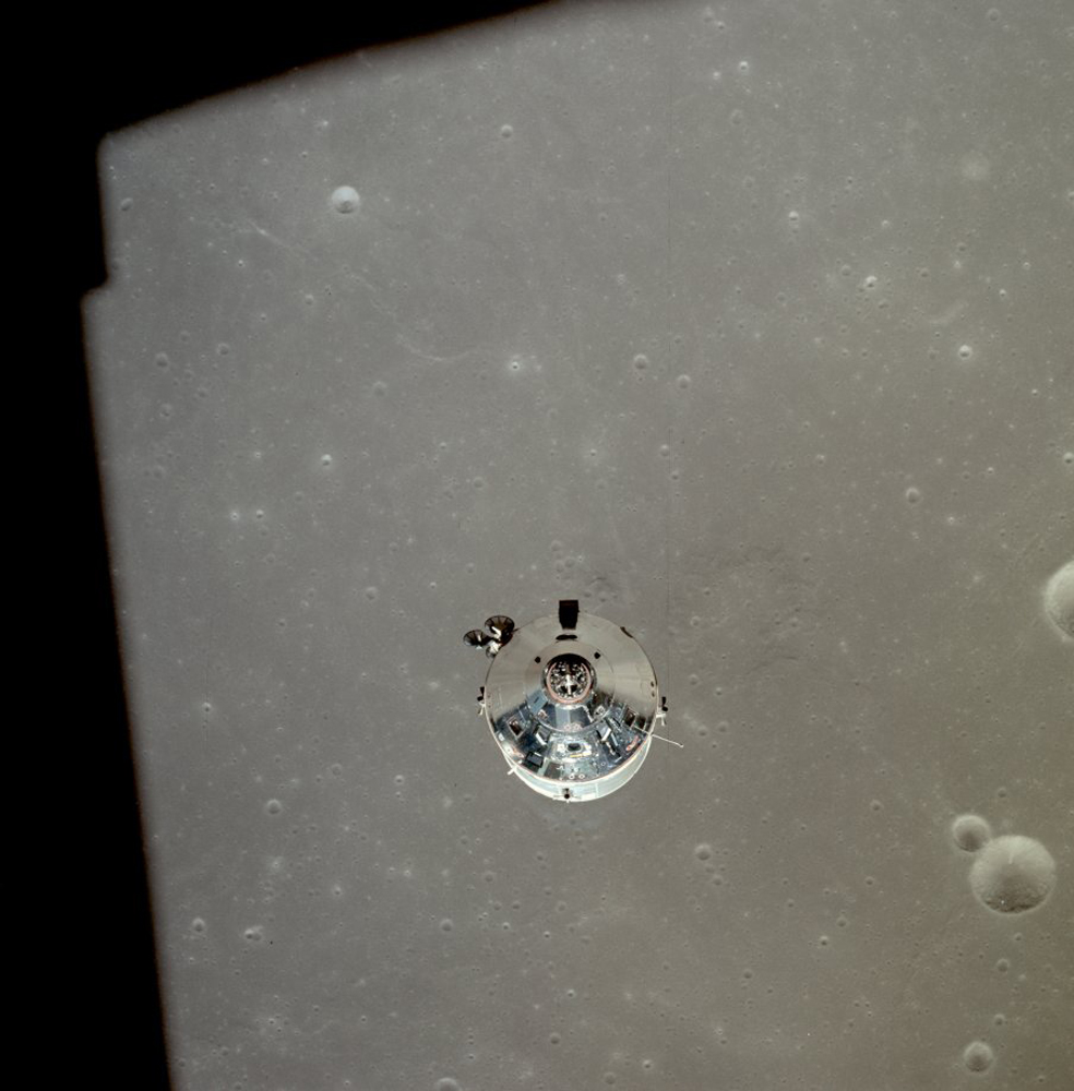 Command service module (CSM) in orbit over the moon after lunar module separation. Michael Collins was alone in the CSM. Neil Armstrong and Buzz Aldrin were in the LM.