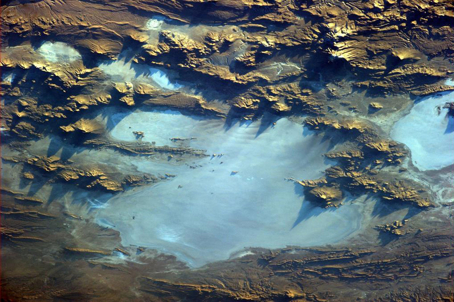 Close-up of gigantic Salar of Uyuni in Bolivia. You can even see the salt fields and the 'Cactus Island'