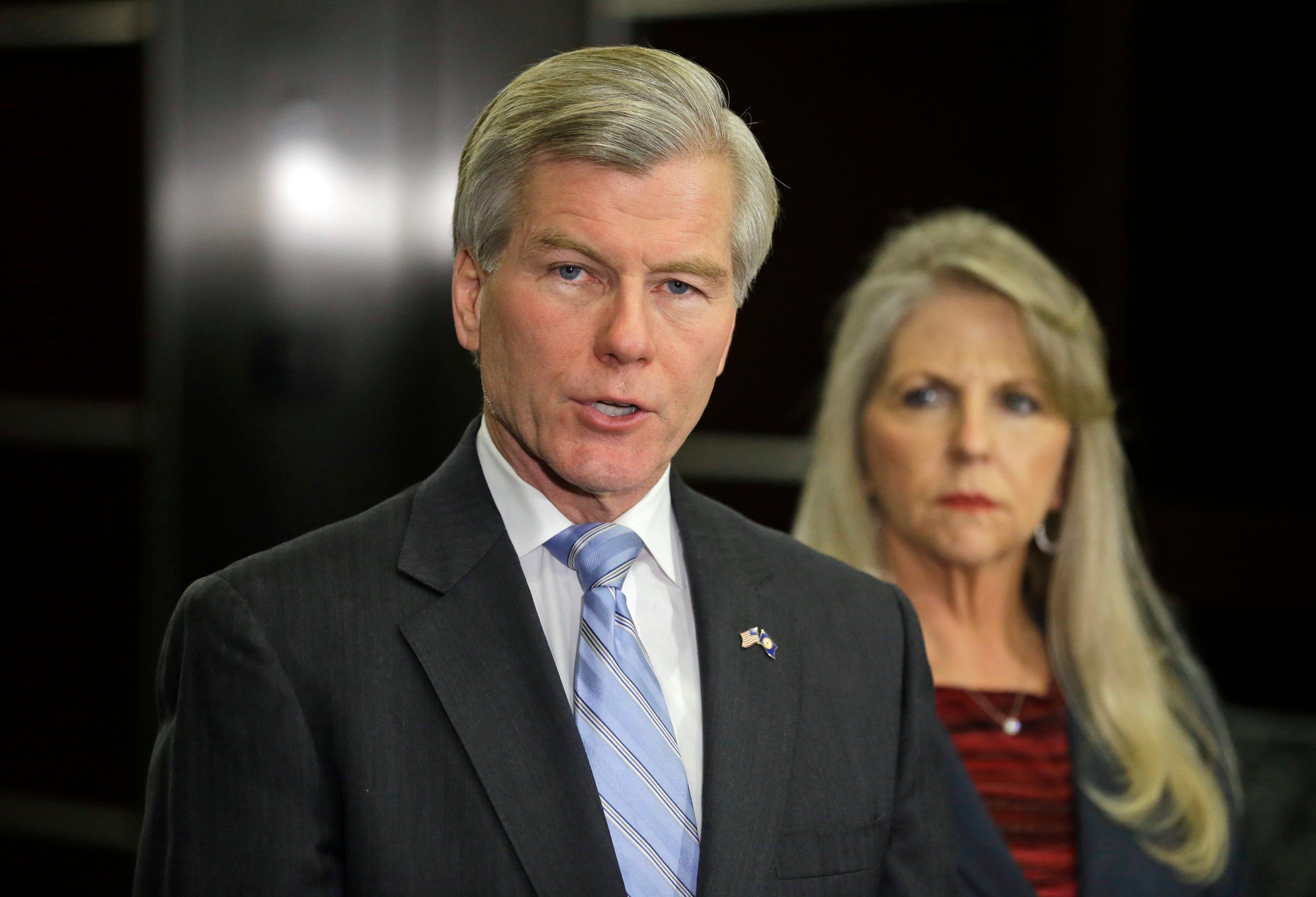 Former Virginia Gov. Bob McDonnell, accompanied by his wife, Maureen, speaks during a news conference in Richmond, Va., Jan. 21, 2014. (Steve Helber—AP)