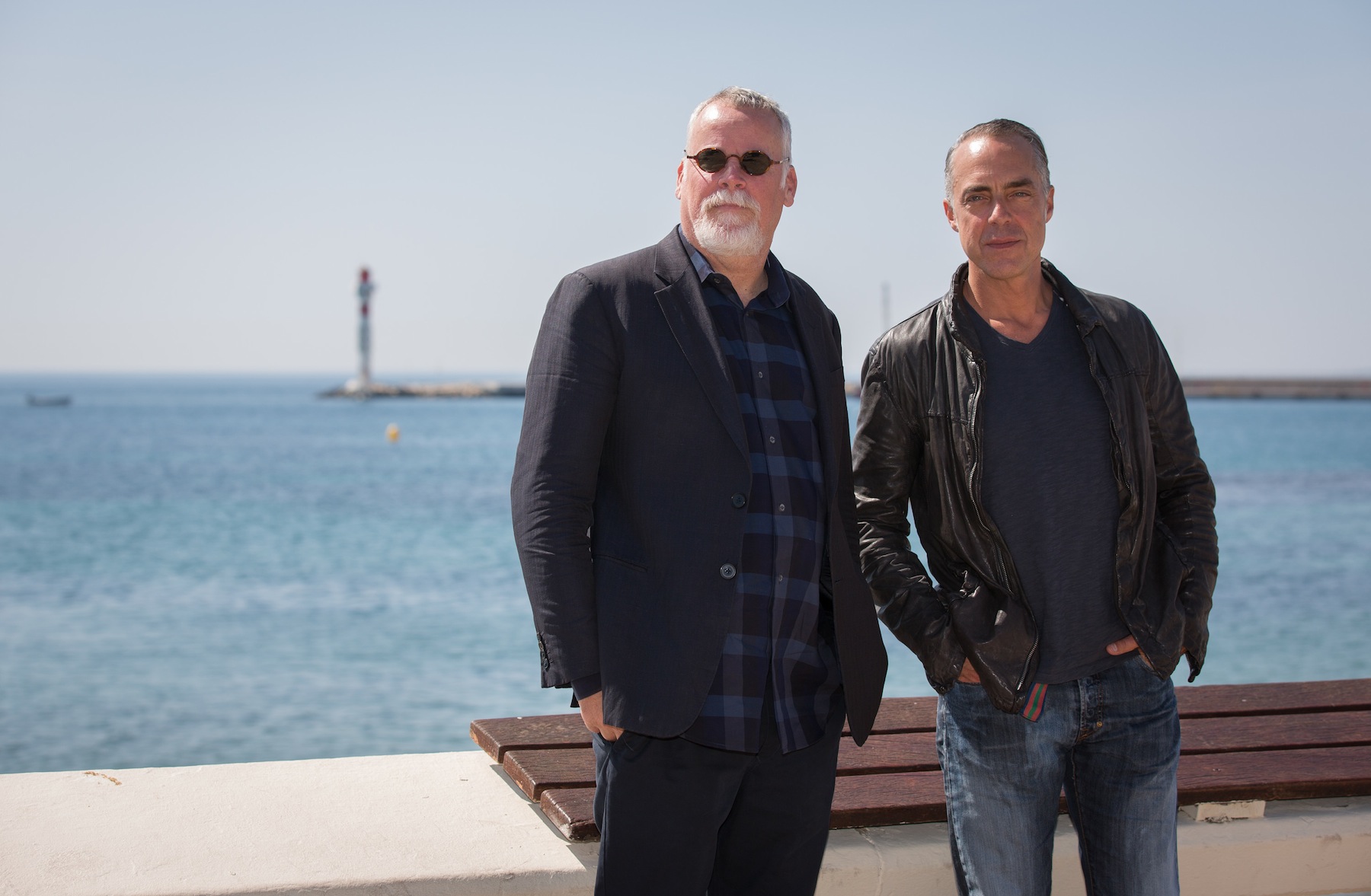 Michael Connelly (L) and 'Bosch' star Titus Welliver (R) pose on April 7, 2014 in Cannes, France. (Didier Baverel—WireImage / Getty Images)