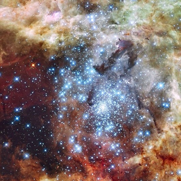 Aug. 16, 2012. Hubble Watches Star Clusters on a Collision Course - Astronomers using data from NASA's Hubble Space Telescope have caught two clusters full of massive stars that may be in the early stages of merging. The 30 Doradus Nebula is 170,000 light-years from Earth.