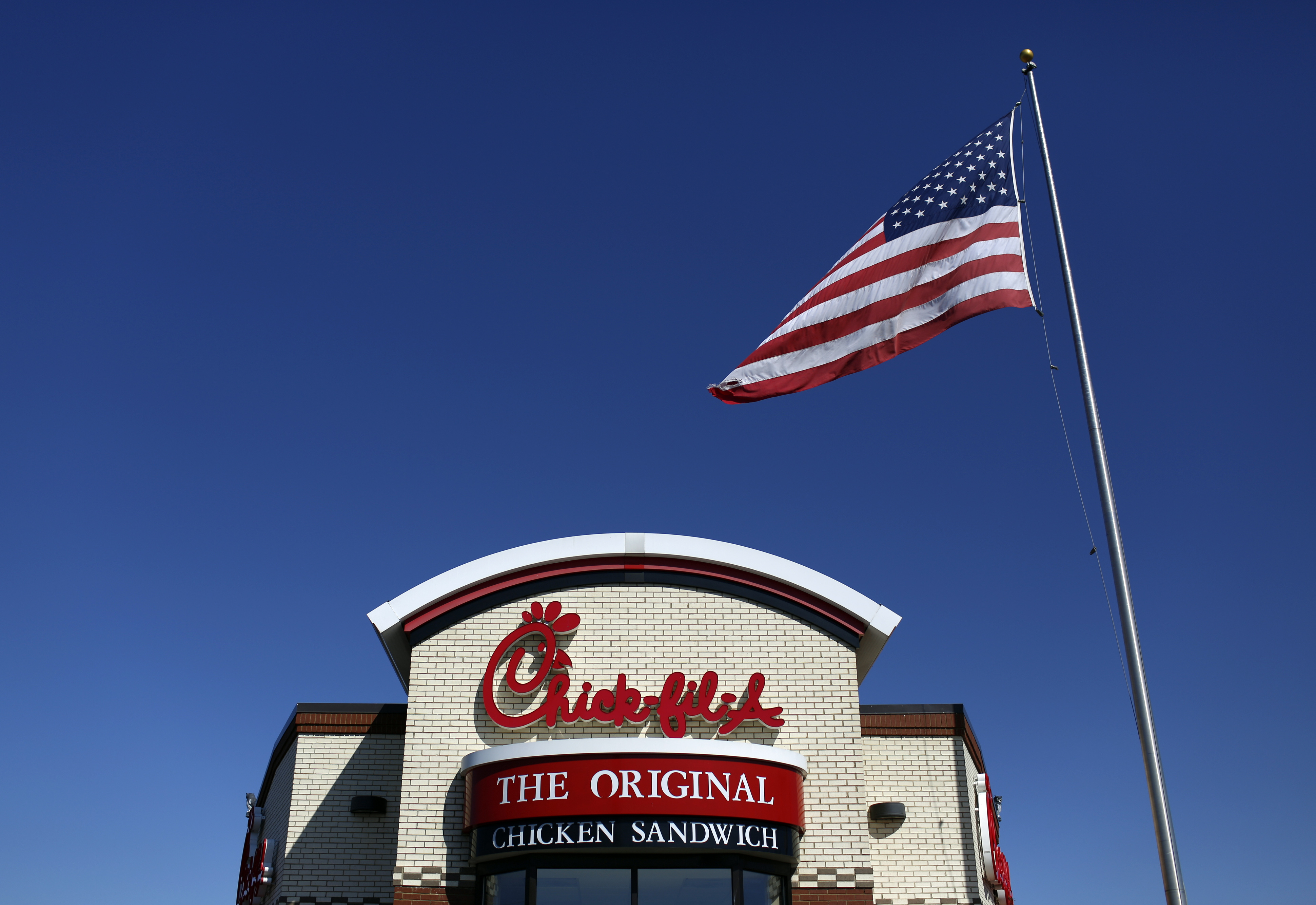 A U.S. flag flies outside a Chick-fil-A Inc. restaurant in Bowling Green, Kentucky, in March 2014. (Bloomberg via Getty Images)