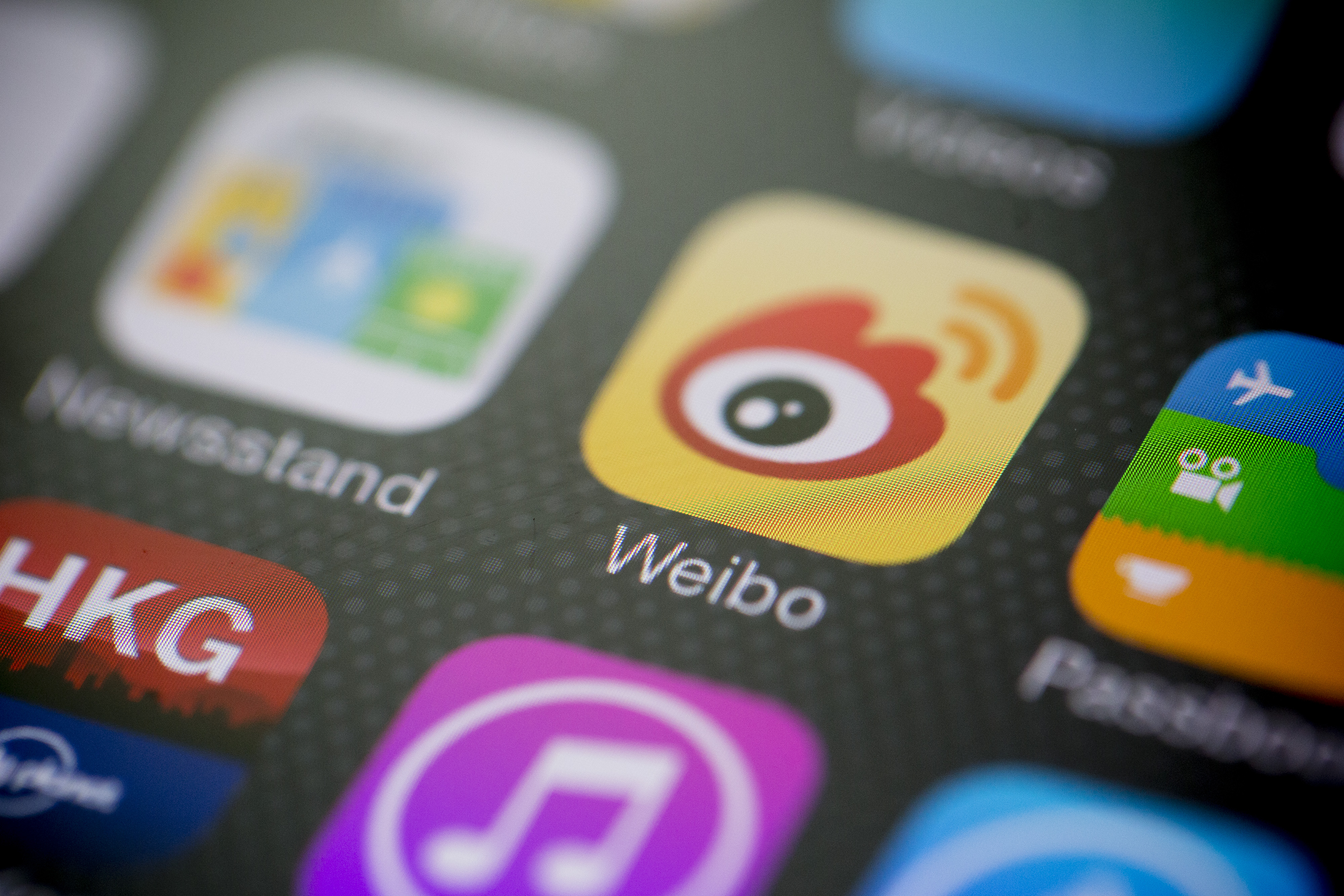 Sina Corp.'s Sina Weibo microblogging service app icon is displayed on an Apple Inc. iPhone 5s in an arranged photograph in Hong Kong, China, on Tuesday, April 22, 2014. (Bloomberg—Bloomberg via Getty Images)