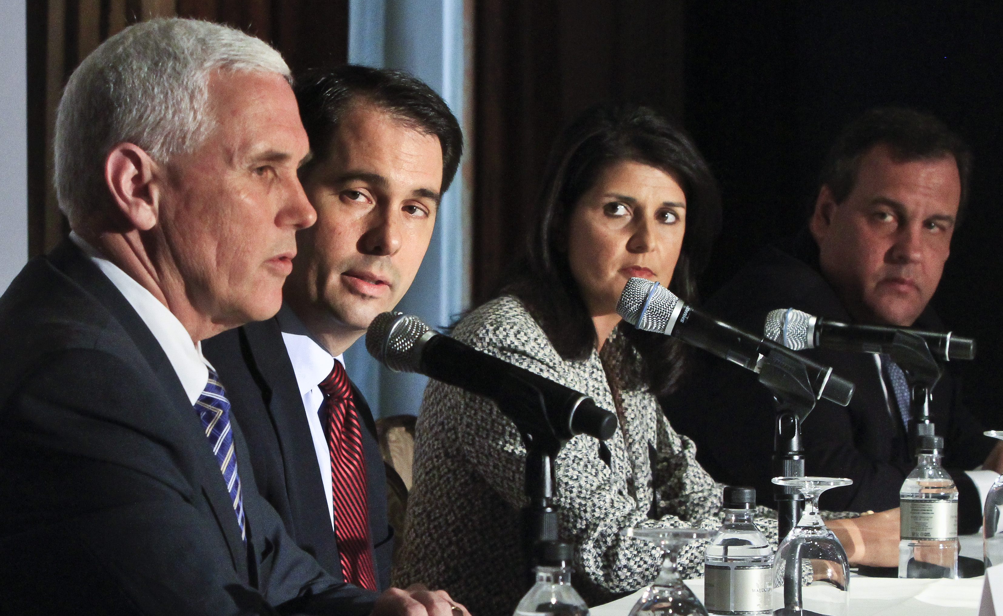 Wisconsin Gov. Scott Walker,  South Carolina Gov. Nikki R. Haley and New Jersey Gov. Chris Christie listen as Indiana Gov. Mike Pence speaks during a press conference at the Republican Governors Association's quarterly meeting on Wednesday May 21, 2014 in New York. (Bebeto Matthews—AP)