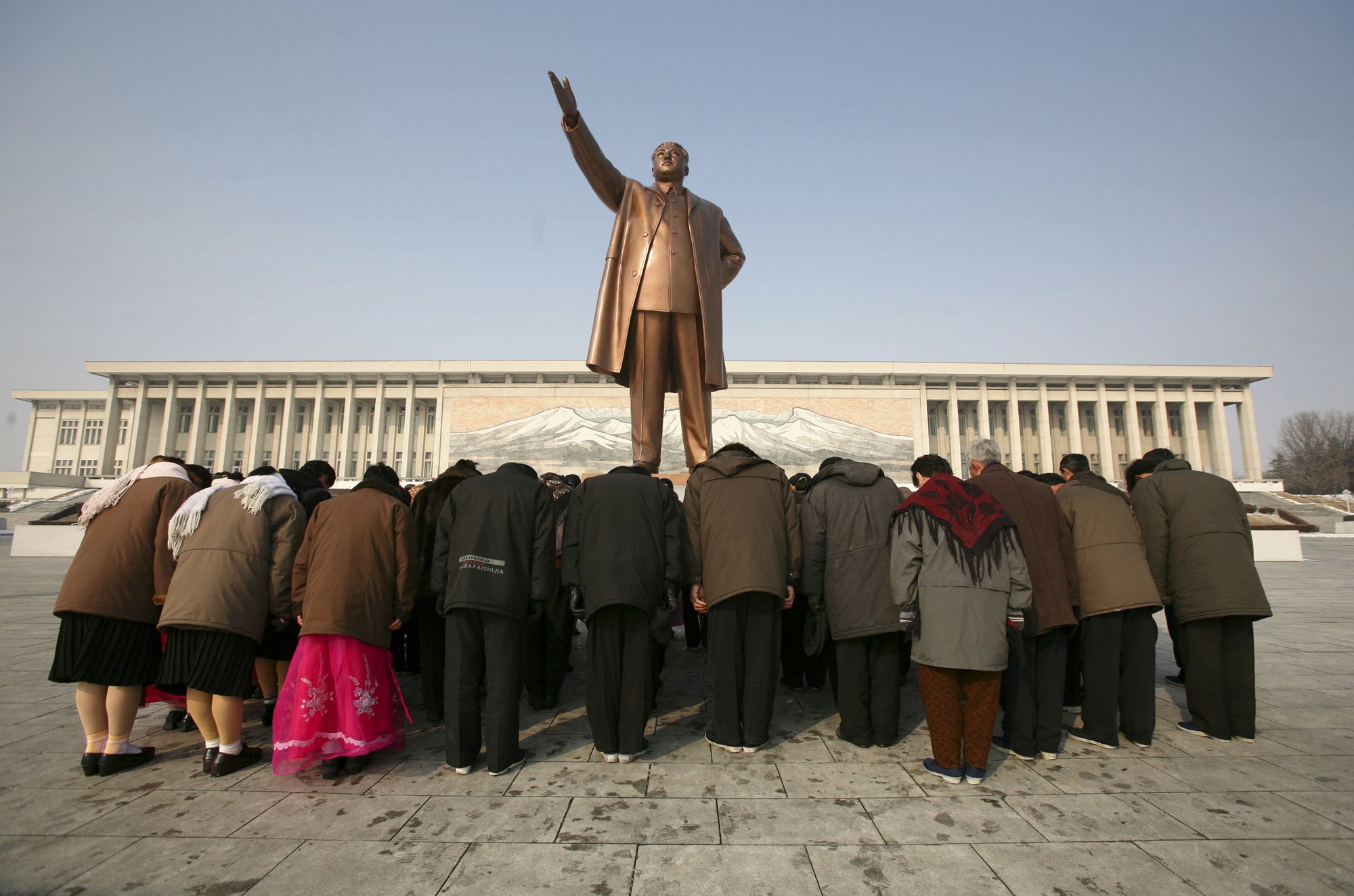 People bow in front of a statue of Kim Il Sung in Pyongyang, North Korea, Feb. 26, 2008.