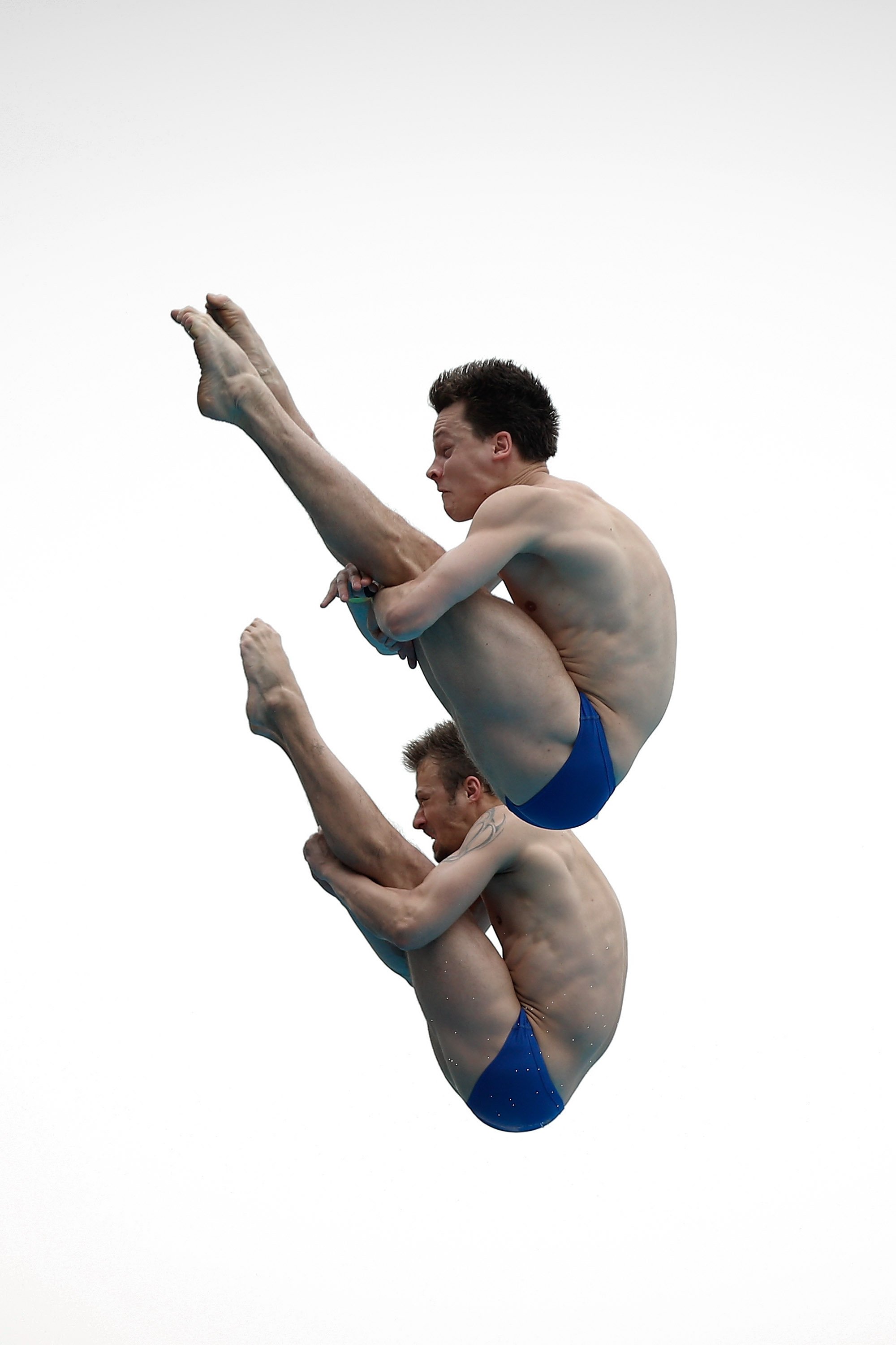 Sascha Matthias Klein and Patrick Hausding of Germany compete in the men's 10M Synchro Springboard Preliminary on day two of the 19th FINA Diving World Cup at the Oriental Sports Center in Shanghai on July 16, 2014.
