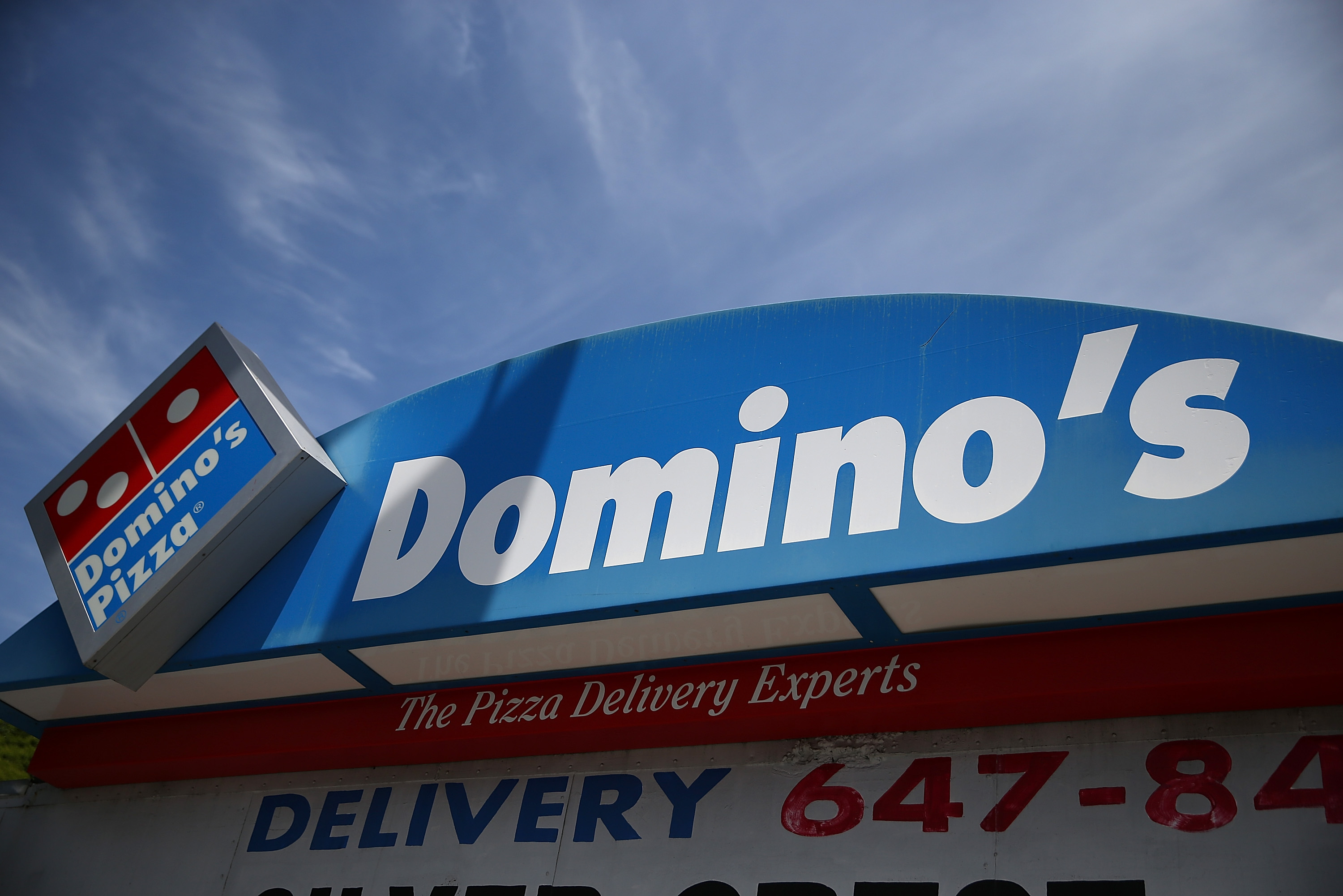 A sign is posted outside of a Domino's Pizza restaurant on May 1, 2014 in San Francisco, California. (Justin Sullivan—Getty Images)