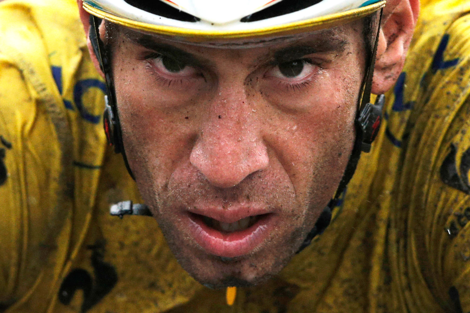 Italy's Vincenzo Nibali, wearing the overall leader's yellow jersey, crosses the finish line of the fifth stage of the Tour de France cycling race in Arenberg, France, on July 9, 2014.