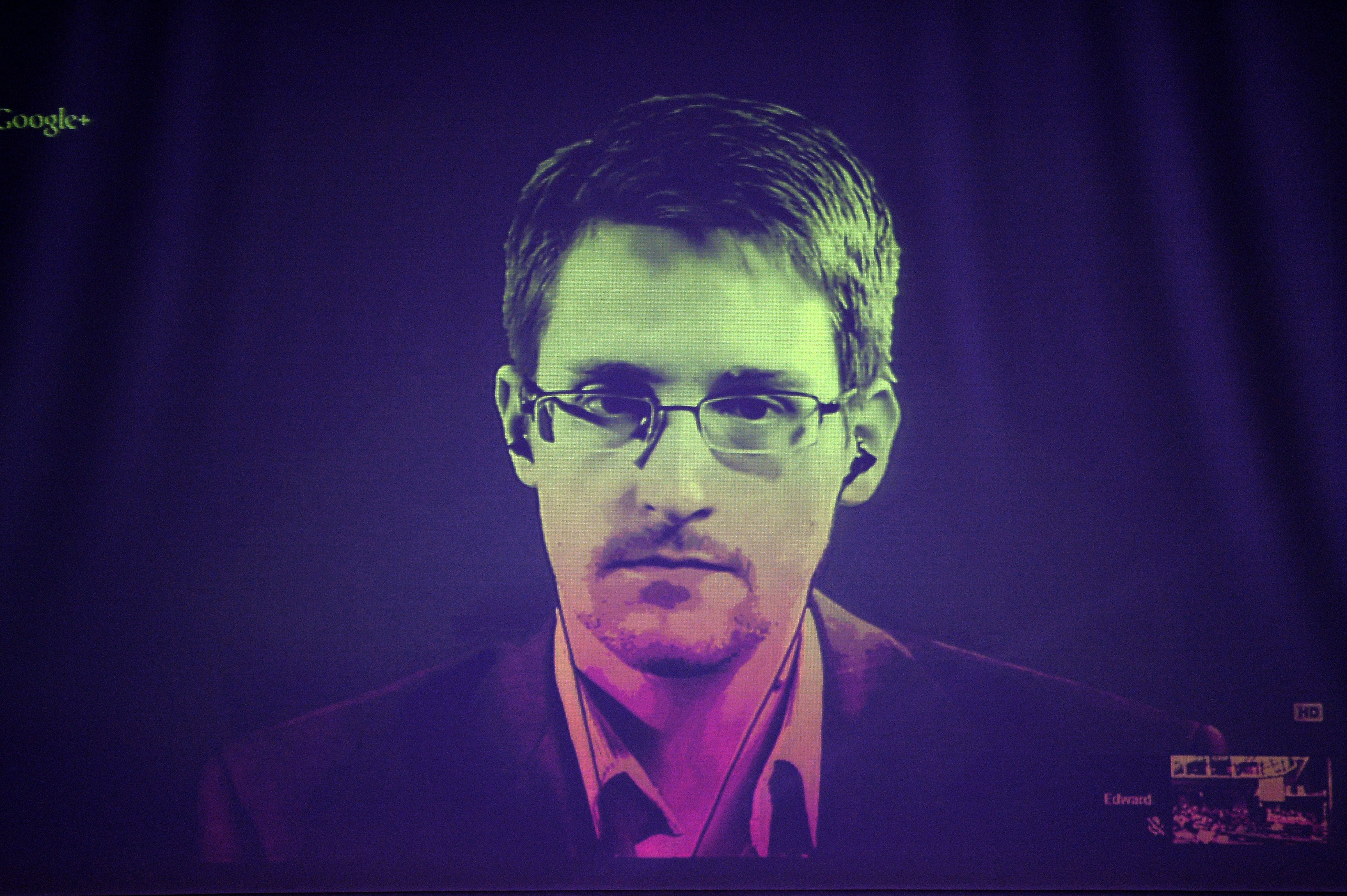 US National Security Agency (NSA) whistleblower Edward Snowden speaks to European officials via videoconference during a parliamentary hearing on improving the protection of whistleblowers, at the Council of Europe in Strasbourg, eastern France, on June 24, 2014. (Frederick Florin—AFP/Getty Images)
