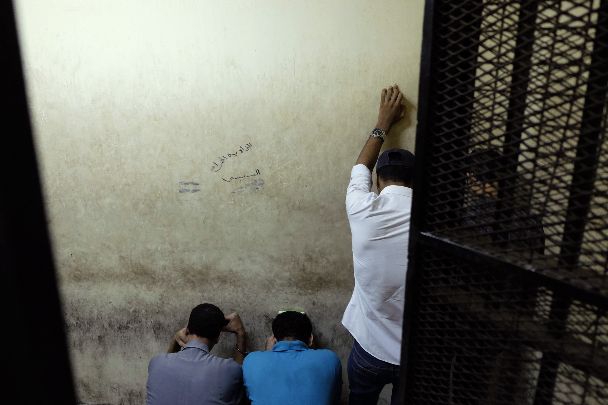Egyptian men sentenced to life in prison for sexual assaults on women during a number of public rallies in Cairo's iconic Tahrir Square, attend their trial at a court in Cairo, July 16, 2014. (Aly Hazza—El Shorouk/AP)
