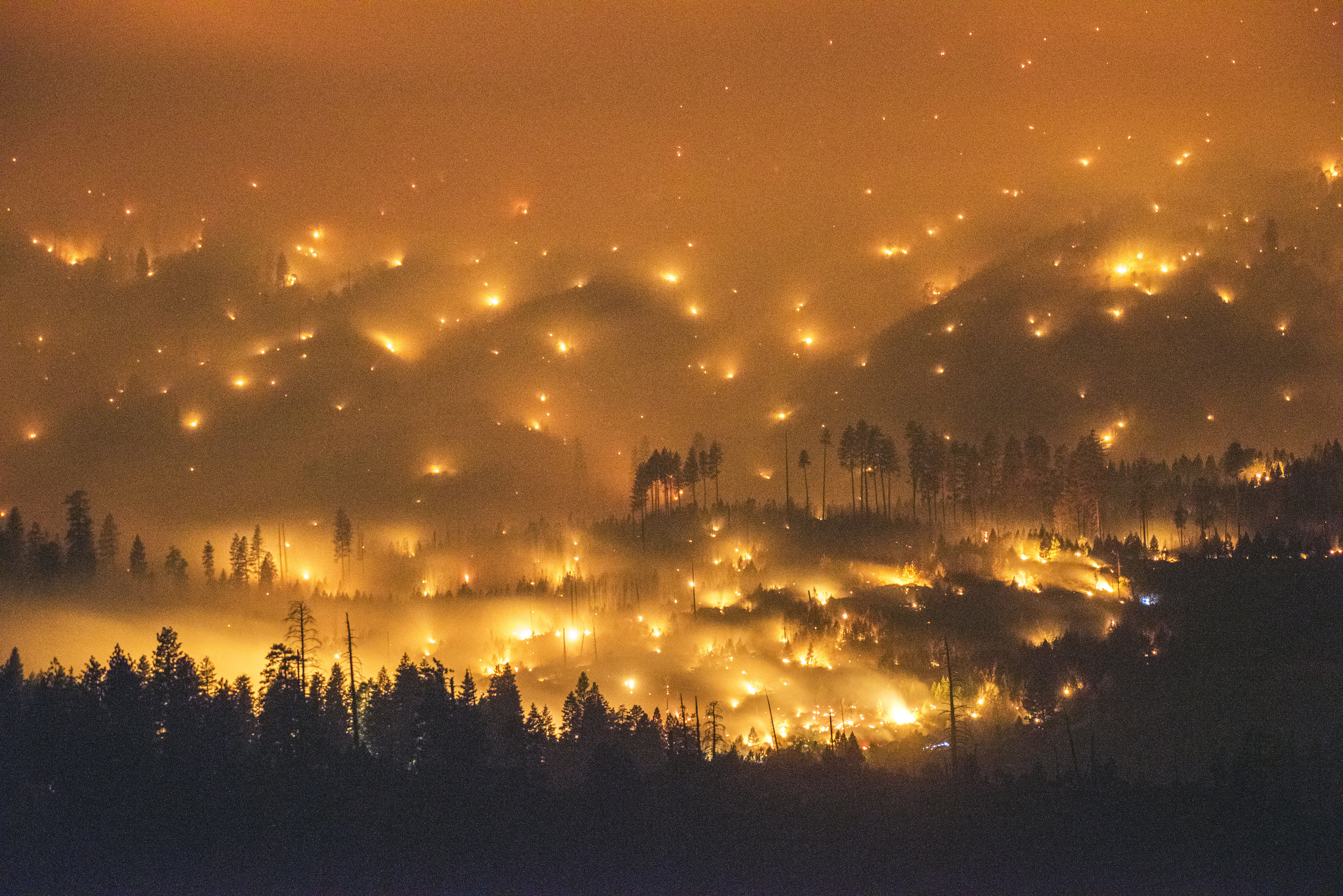A long exposure image shows the El Portal Fire burning near Yosemite National Park, Calif., on July 27, 2014.