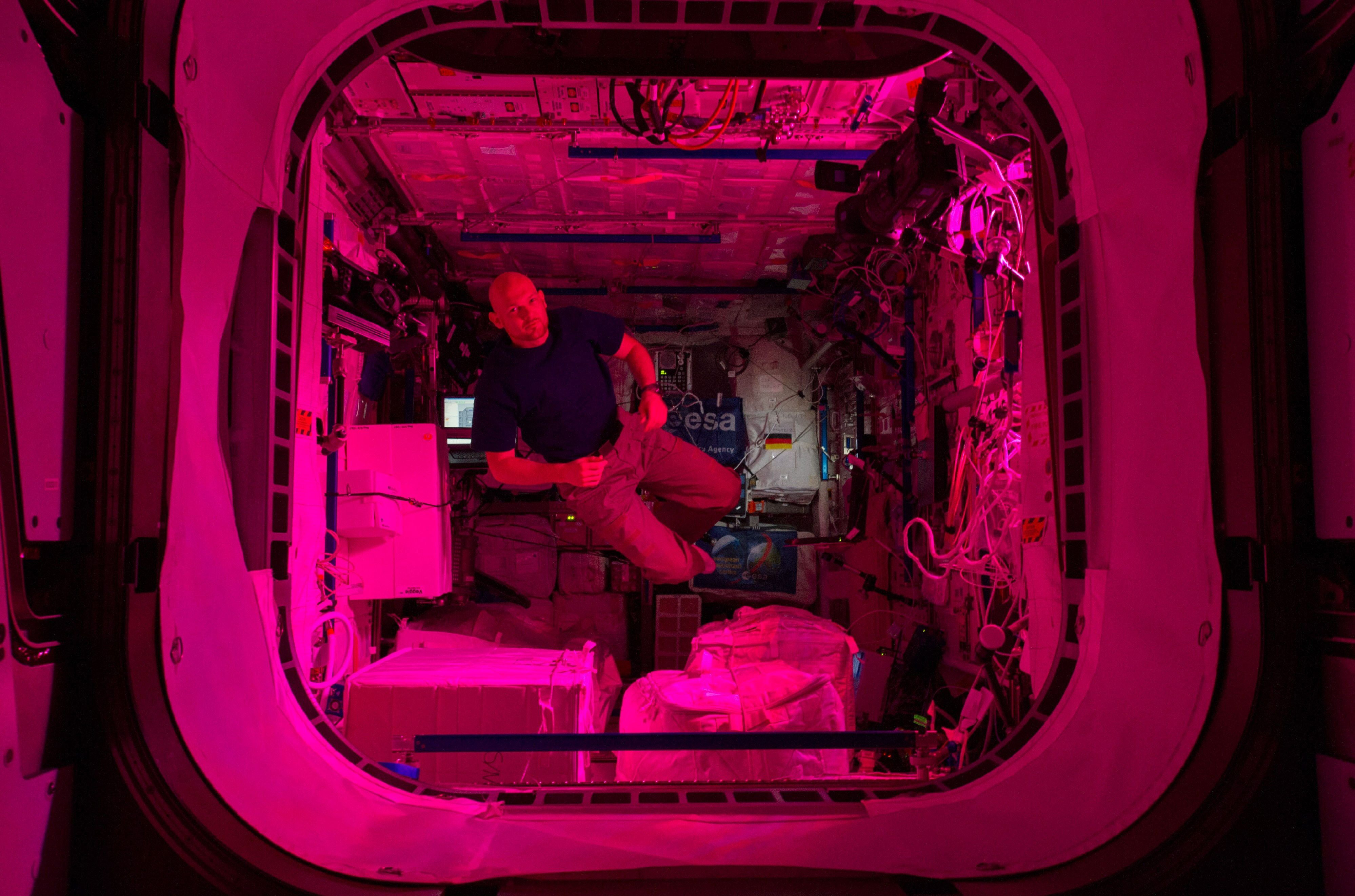Astronaut Alexander Gerst floats frrely in the Columbus laboratory of the International Space Station.