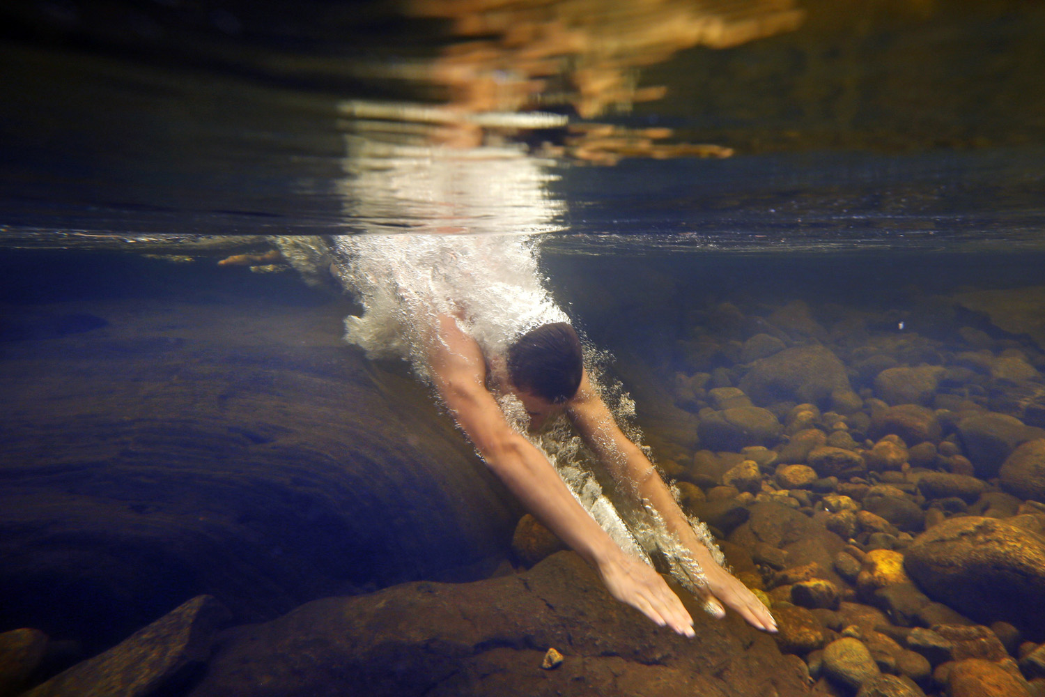Jul. 11, 2014. Russell Norris, 15, of Tylertown, Miss., dives into the chilly Swift River at Coos Canyon in Byron, Maine. The canyon is considered one of the premier swimming holes in the U.S.