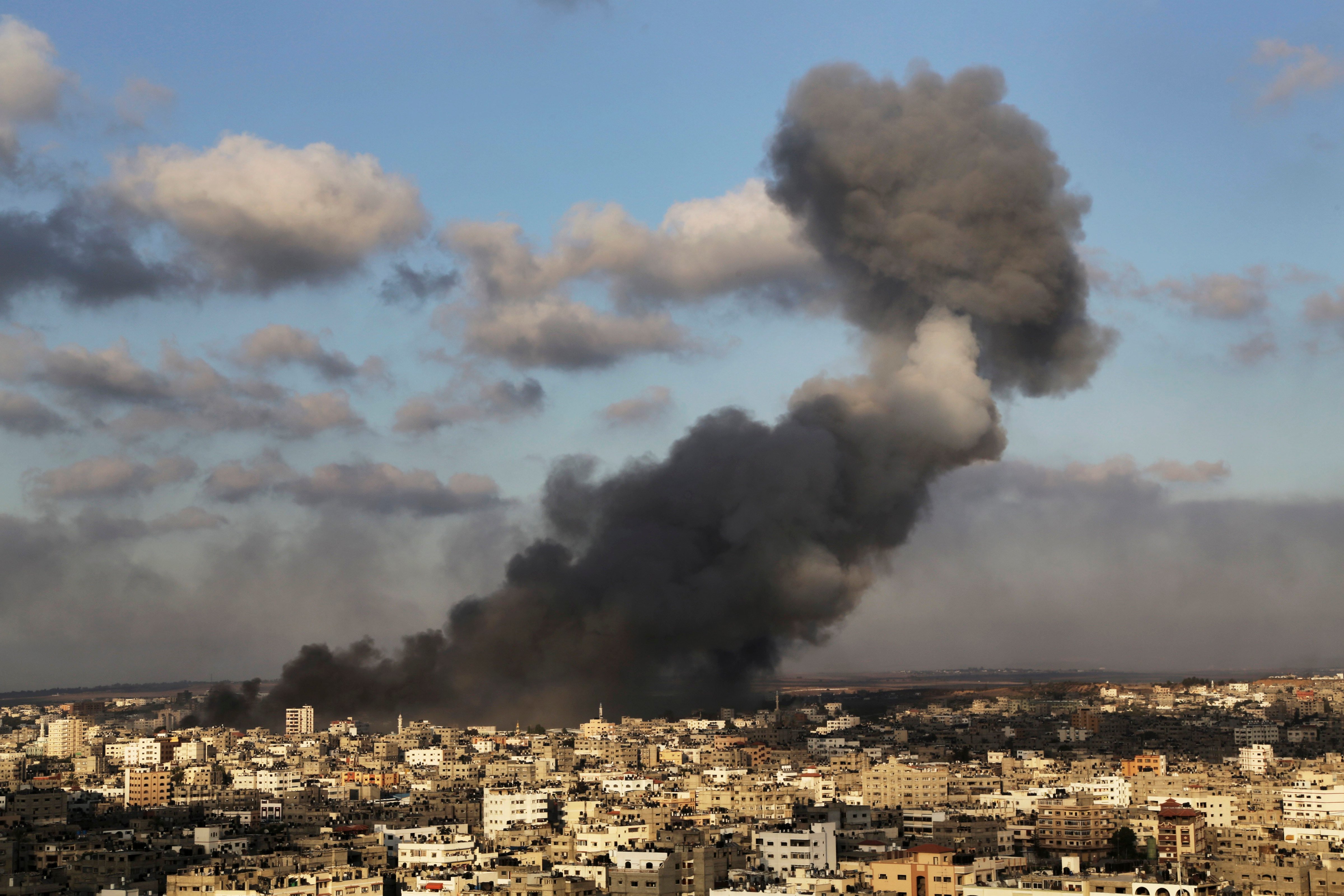 Smoke from an Israeli strike rises over Gaza City on July 24, 2014. (Adel Hana—AP)