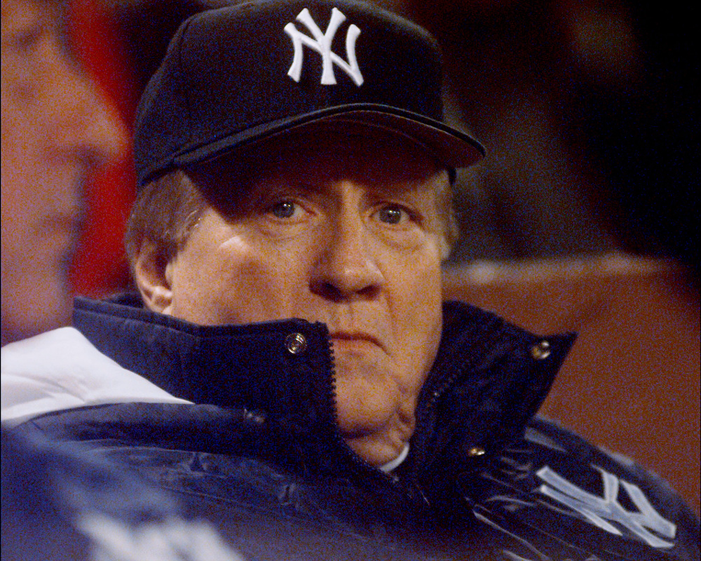 New York Yankees' owner George Steinbrenner is bundled up ag