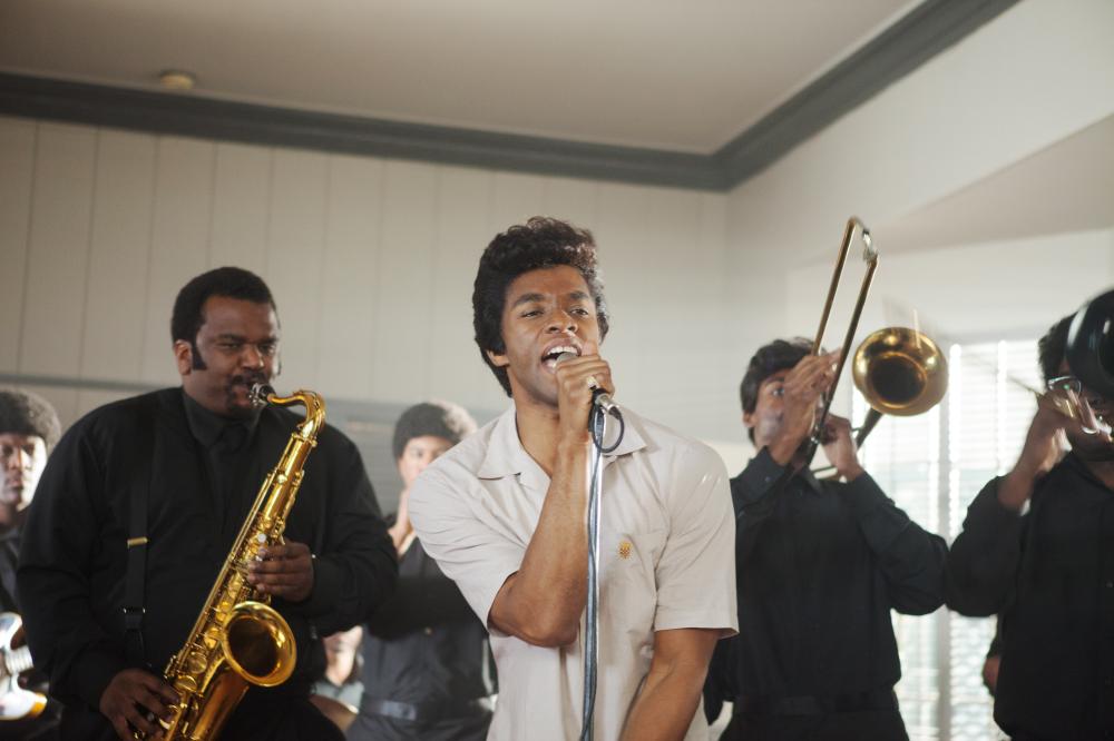 Left: Craig Robinson, center: Chadwick Boseman (as James Brown), Get On Up, 2014. (Universal Pictures)
