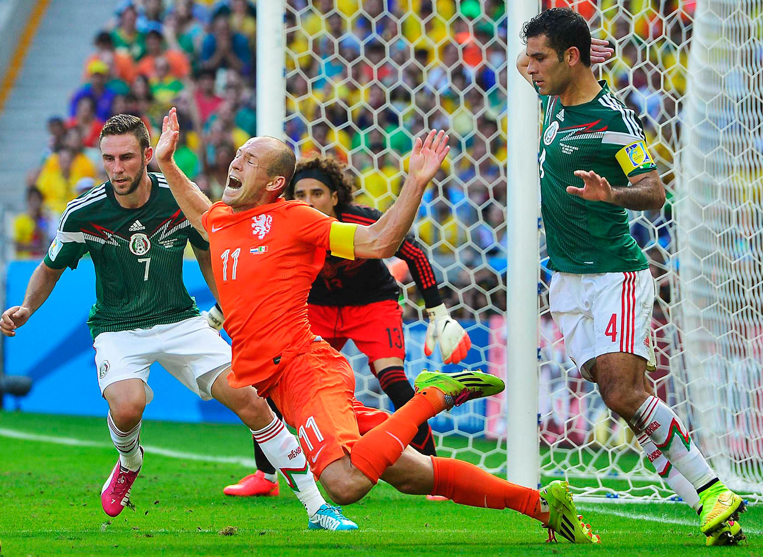 Mexico's Rafael Marquez fouls Arjen Robben of the Netherlands in the box at the Estadio Castelao in Fortaleza, Brazil on June 29, 2014.