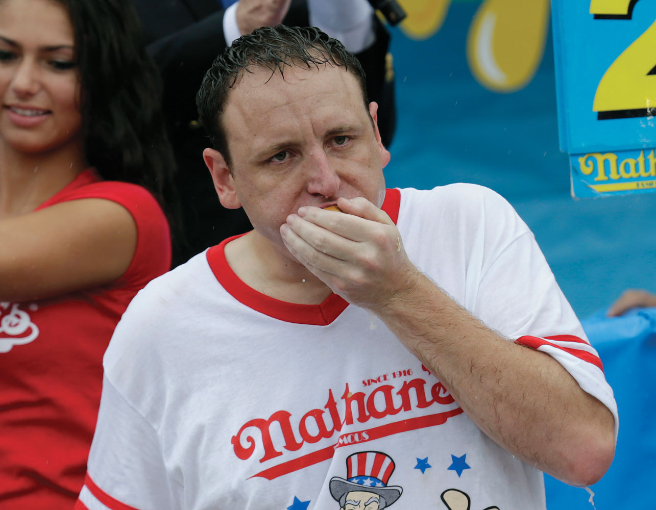 Joey Chestnut, the defending champion and a world record holder,  devoured a total of 61 hot dogs for his eighth title.