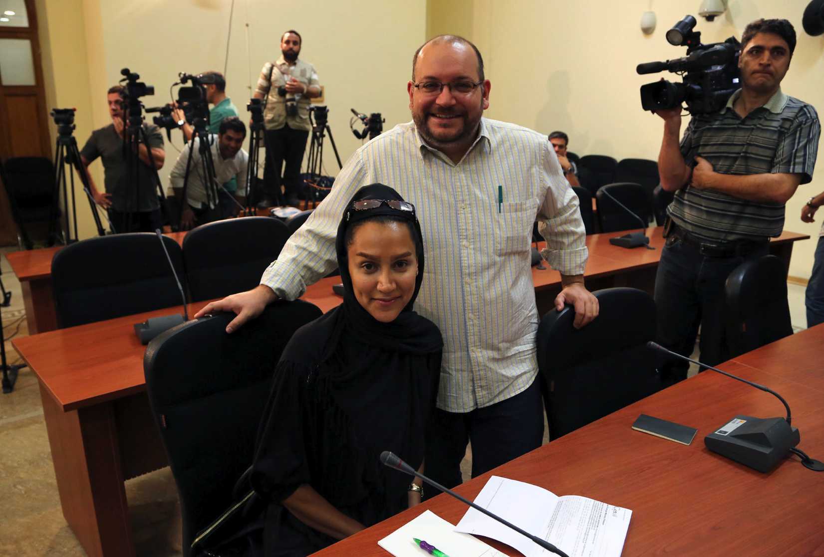 Washington <i>Post</i> Iranian-American journalist Jason Rezaian, right, and his Iranian wife Yeganeh Salehi, who works for the the <i>National</i>, an UAE newspaper, during a Foreign Ministry weekly press conference in Tehran on Sept. 10, 2013 (EPA)