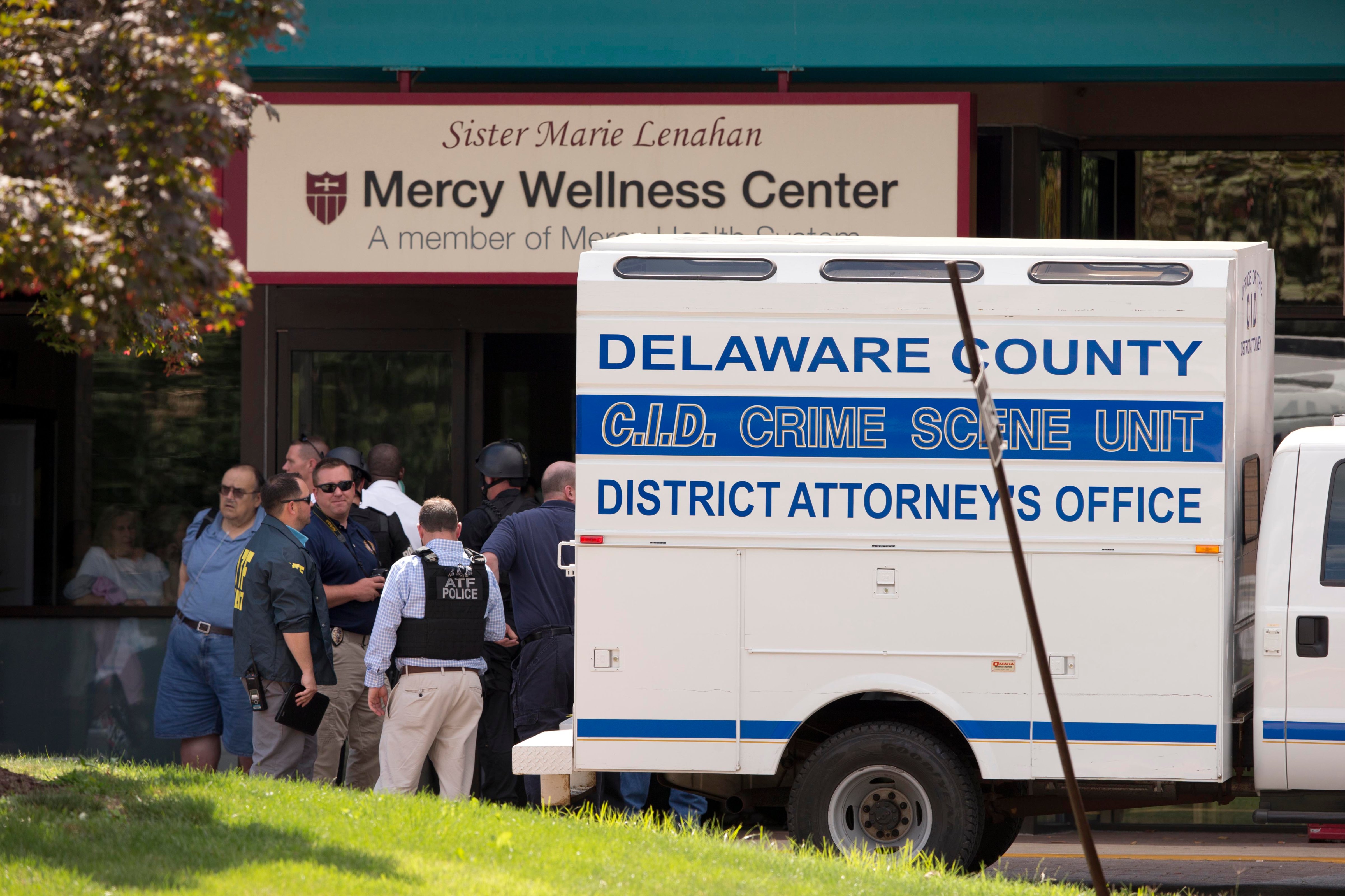 Investigators work the scene of a shooting Thursday, July 24, at Mercy Fitzgerald Hospital in Darby, Pa. (AP)
