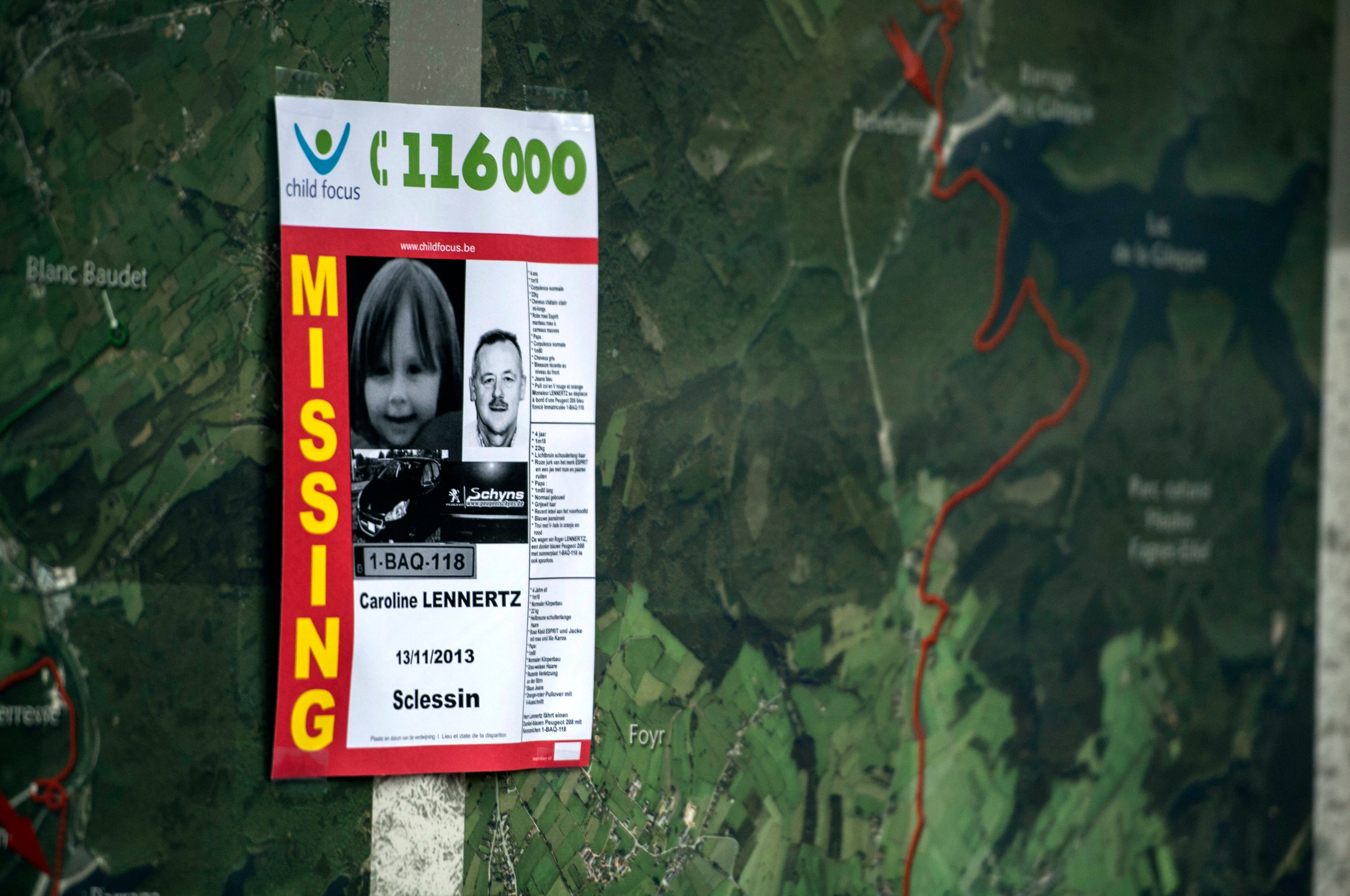 A Child Focus poster displayed during the ongoing search for a missing father and daughter in Belgium reported missing in November 2013. (AFP/Getty Images)