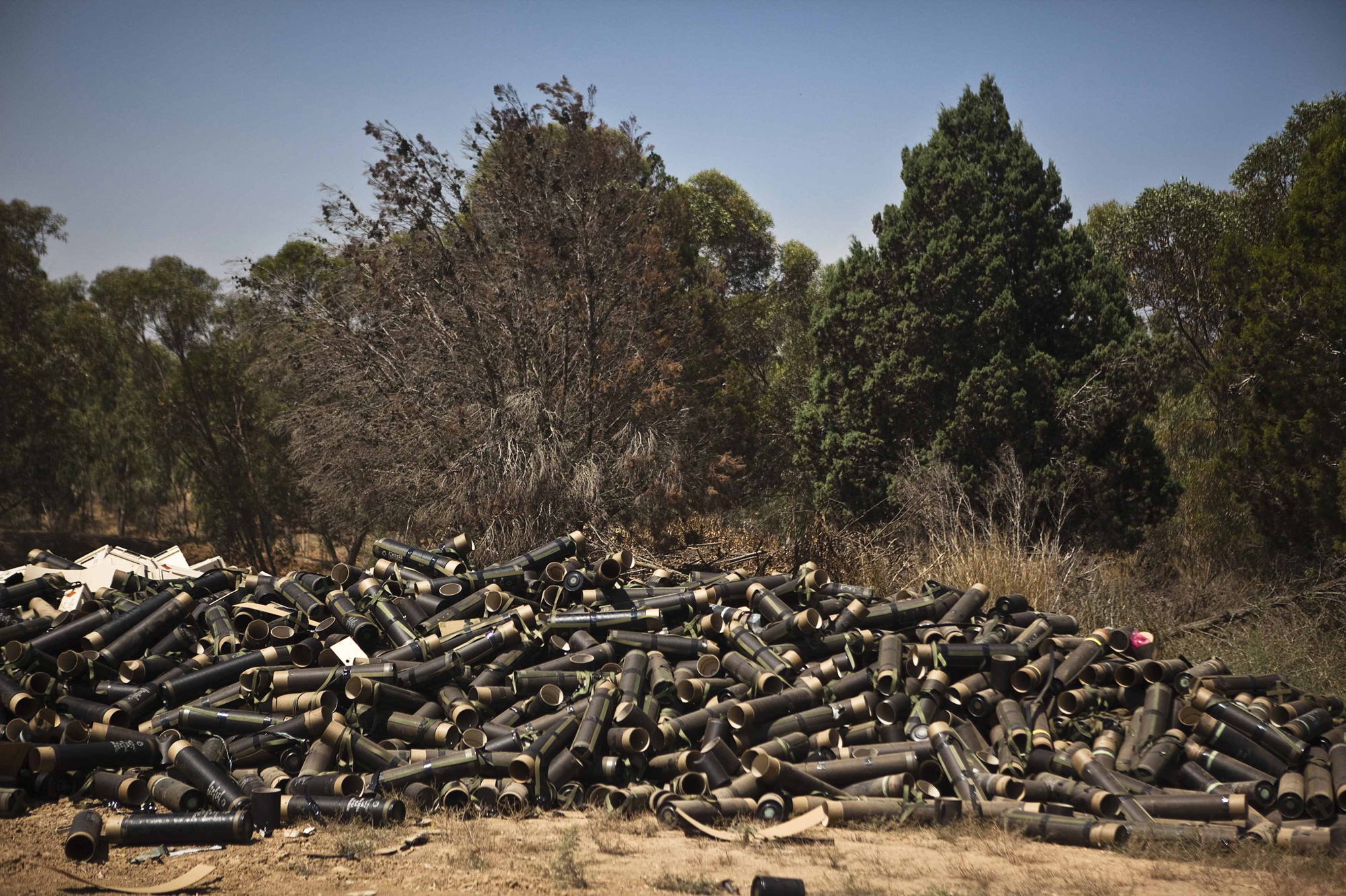 Mortar cases are piled at a military staging area near the border with the Gaza Strip, July 24, 2014.