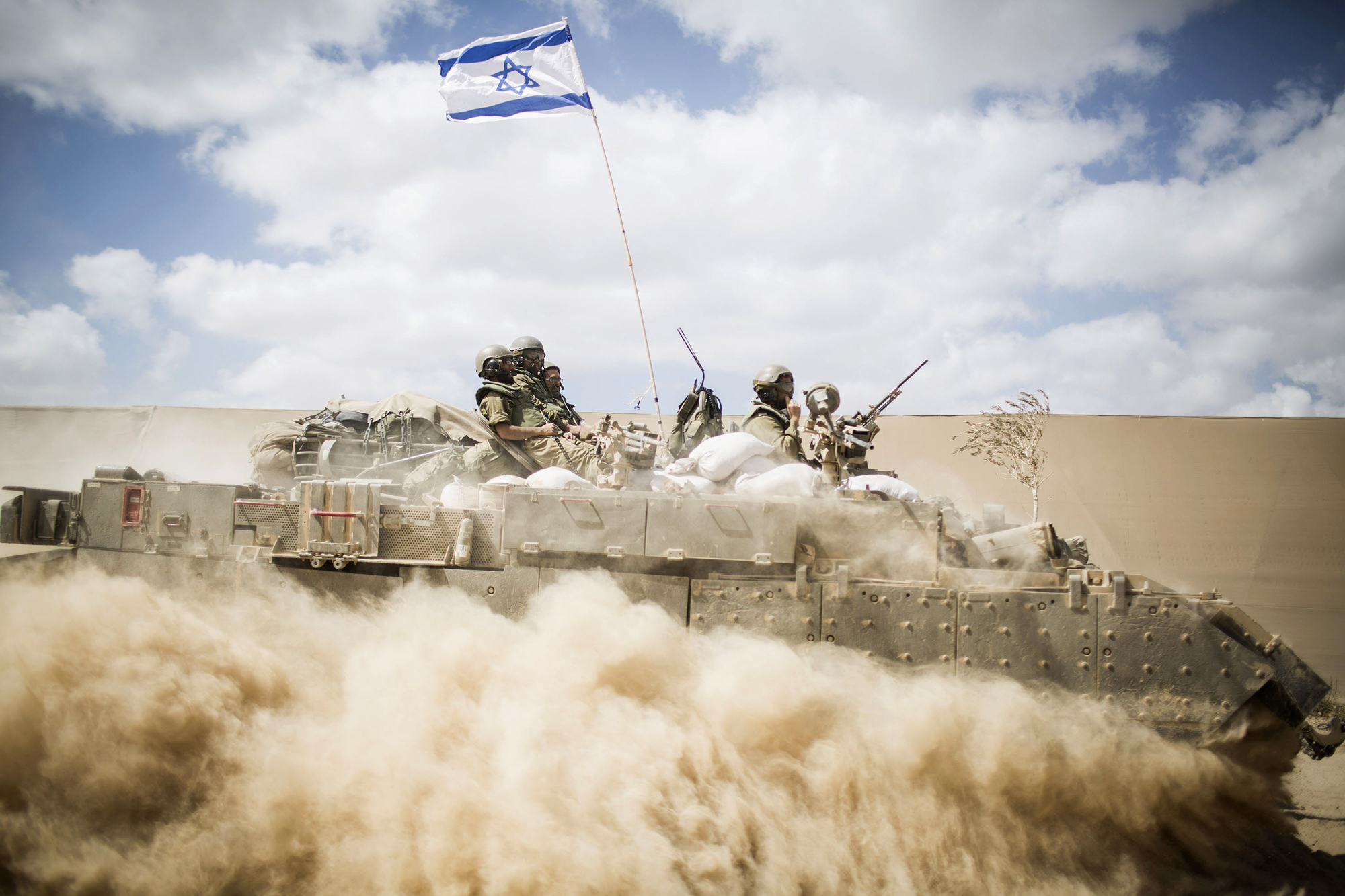 An Israeli armed vehicle seen passing near the Israeli-Gaza border on July 25, 2014 near Israel's border with the Gaza Strip. (Ilia Yefimovich—Getty Images)