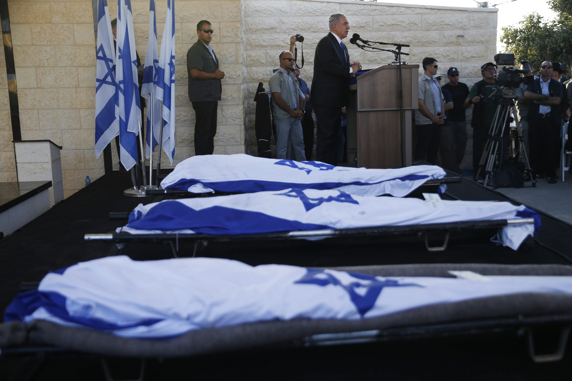 Israeli Prime Minister Benjamin Netanyahu eulogizes three Israeli teens who were abducted and killed in the occupied West Bank, Gil-Ad Shaer, US-Israeli national Naftali Fraenkel, both 16, and Eyal Yifrah, 19, during their joint funeral in the Israeli city of Modi'in, July 1.