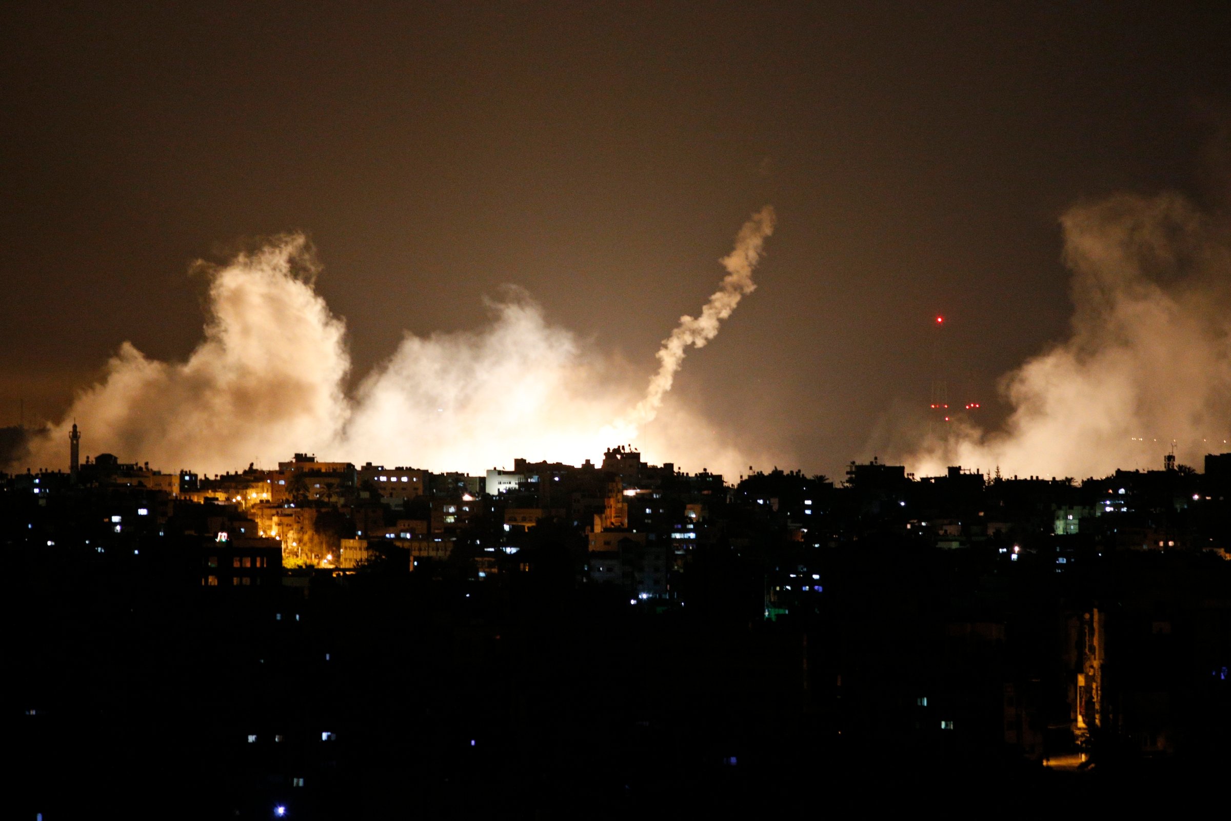 Smoke from flares rises in the sky in Gaza City, in the northern Gaza Strip on July 17, 2014.