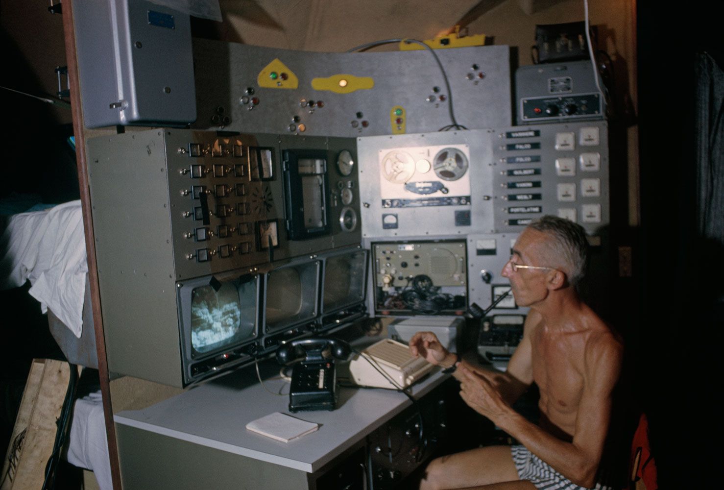 Jacques Cousteau works at an audio-visual machine during the Conshelf II Expedition.