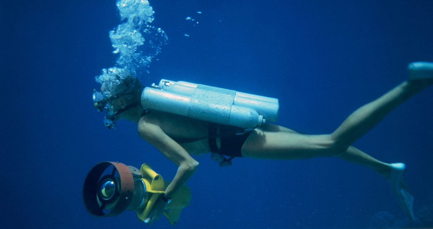 Captain Jacques Cousteau explores the water surrounding the Conshelf II submersible.