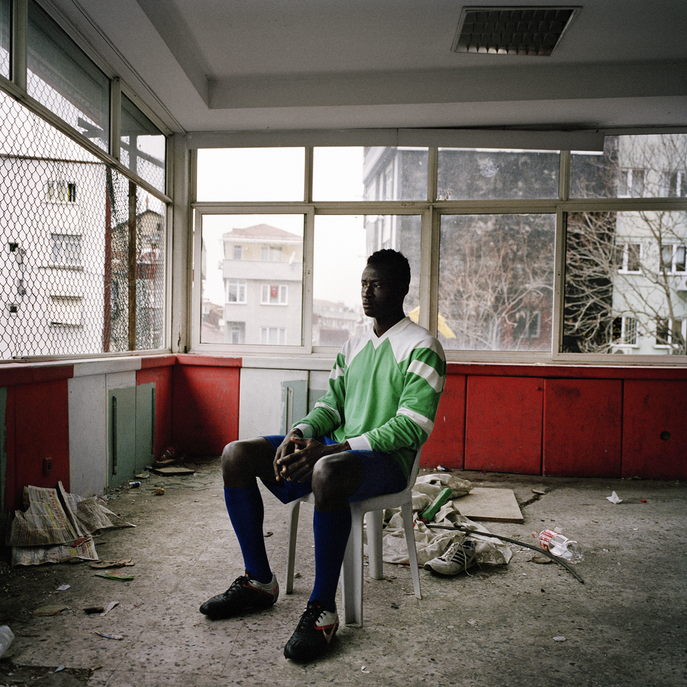 Dayo, A Nigerian footballer living in Turkey, sit’s for a portrait inside the second floor of the run-down Feriköy Pitch in Istanbul where he trains 5-days a week in April 2013 in Istanbul, Turkey.