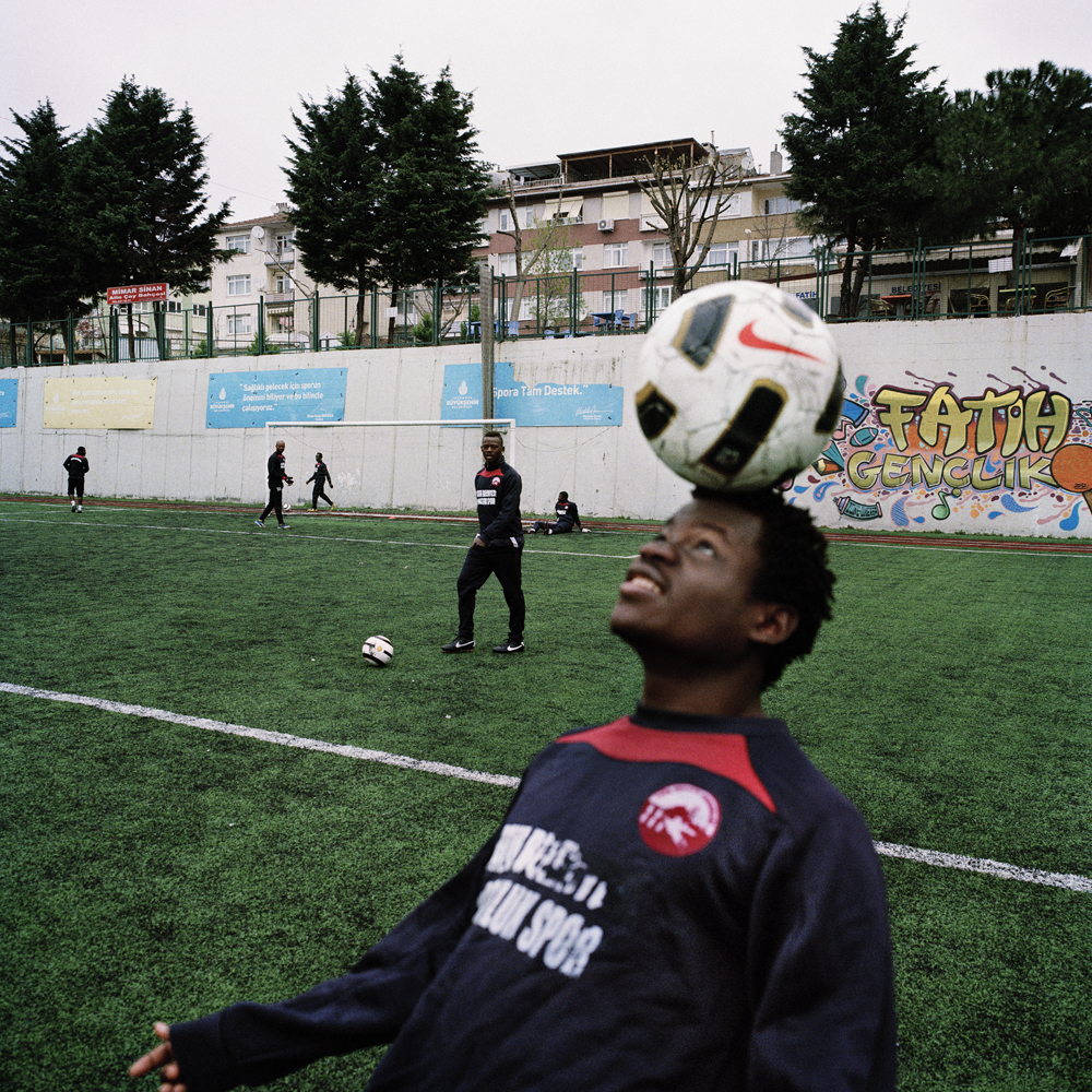 An African footballer practices for the African Friendship Sports team, works with the ball during morning football practice at the Fatih Belediyesi Mimar Sinan Stadium in April 2013 in Istanbul, Turkey.